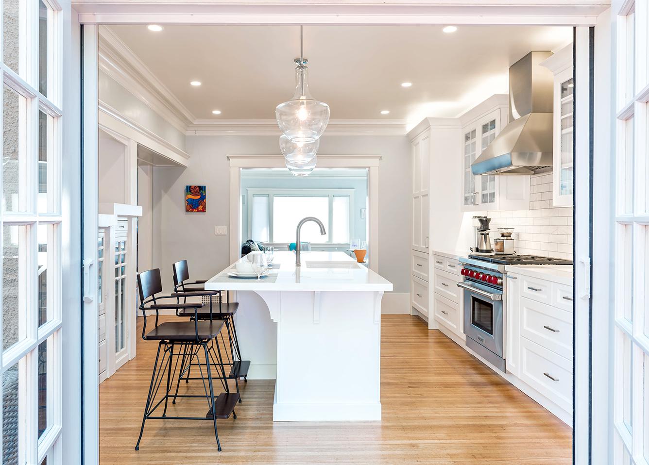 Picture of Roberts Electric Company rewired this REMMIE award-winning kitchen and installed energy-efficient LED lighting and dramatic Kichler pendant lights over the island. - Roberts Electric Company, Inc.