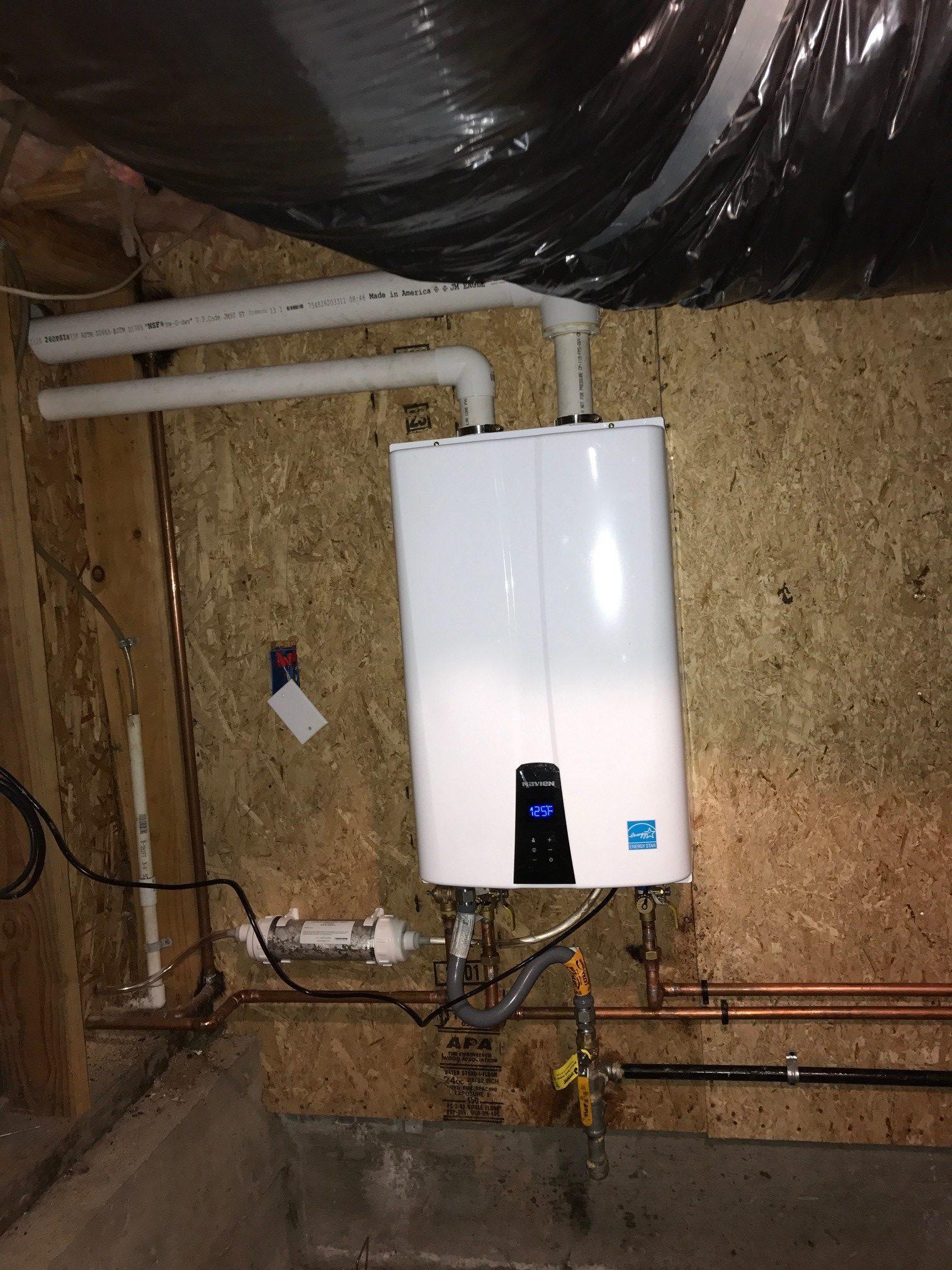 Picture of Absolute Plumbing and Drain installed this tankless water heater in a customer's basement. - Absolute Plumbing and Drain