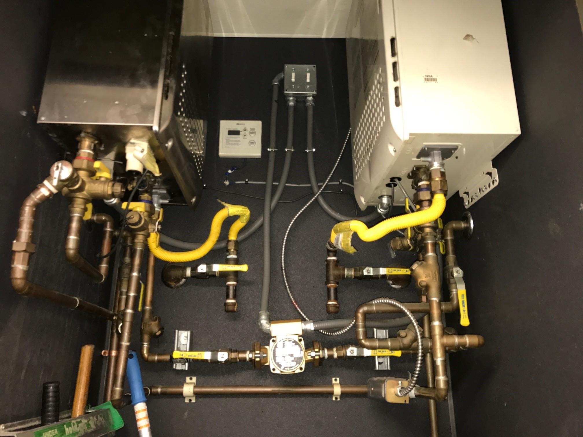 Picture of A recent confined tankless water heater installation by Absolute Plumbing and Drain - Absolute Plumbing and Drain