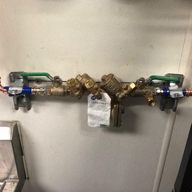 Picture of Absolute Plumbing and Drain installed this backflow device for a commercial client's beverage station. - Absolute Plumbing and Drain