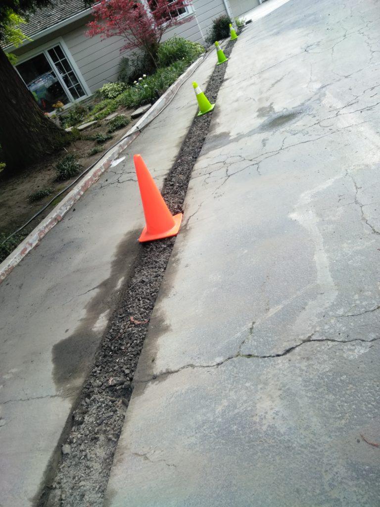 Picture of Absolute Plumbing and Drain replaced this water line in a client's driveway. - Absolute Plumbing and Drain