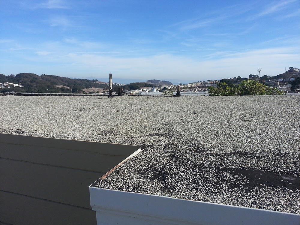 Picture of A "before" shot of a recent flat roof project by Sure Roofing & Waterproofing - Sure Roofing & Waterproofing