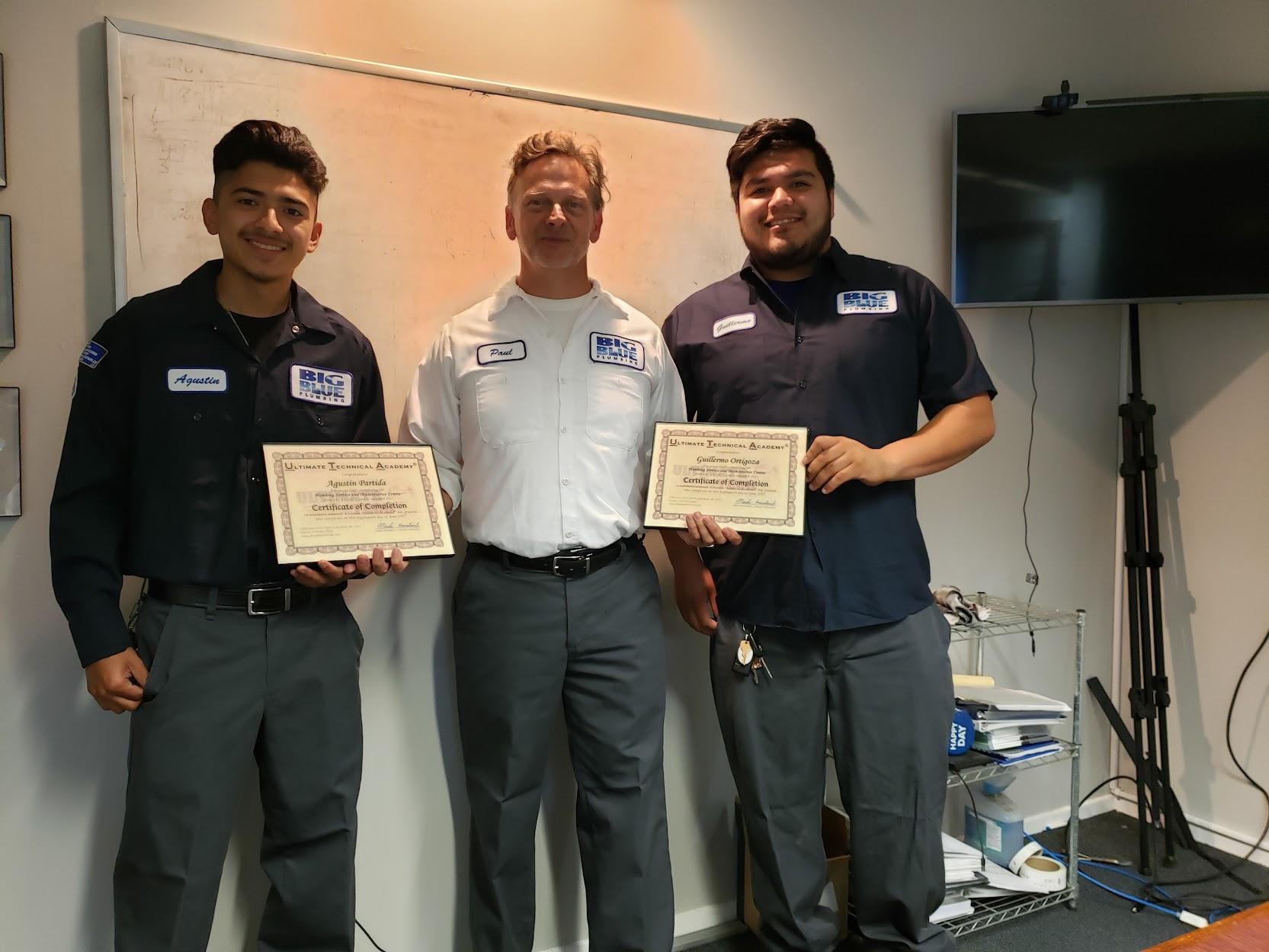Picture of Two Big Blue Plumbing apprentices receive their certifications. - Big Blue Plumbing
