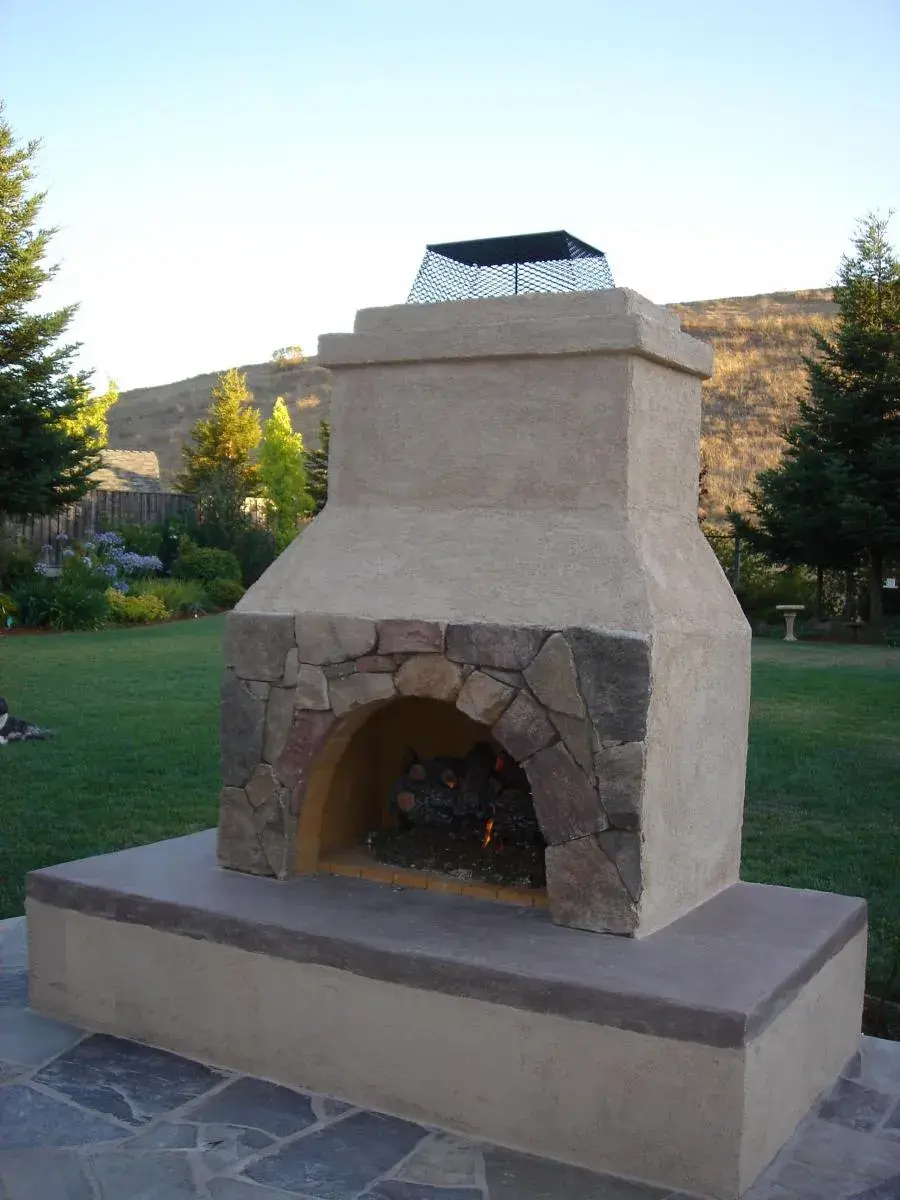 Picture of Pacific Landscaping built this stucco/flagstone fireplace with a sitting area. - Pacific Landscaping