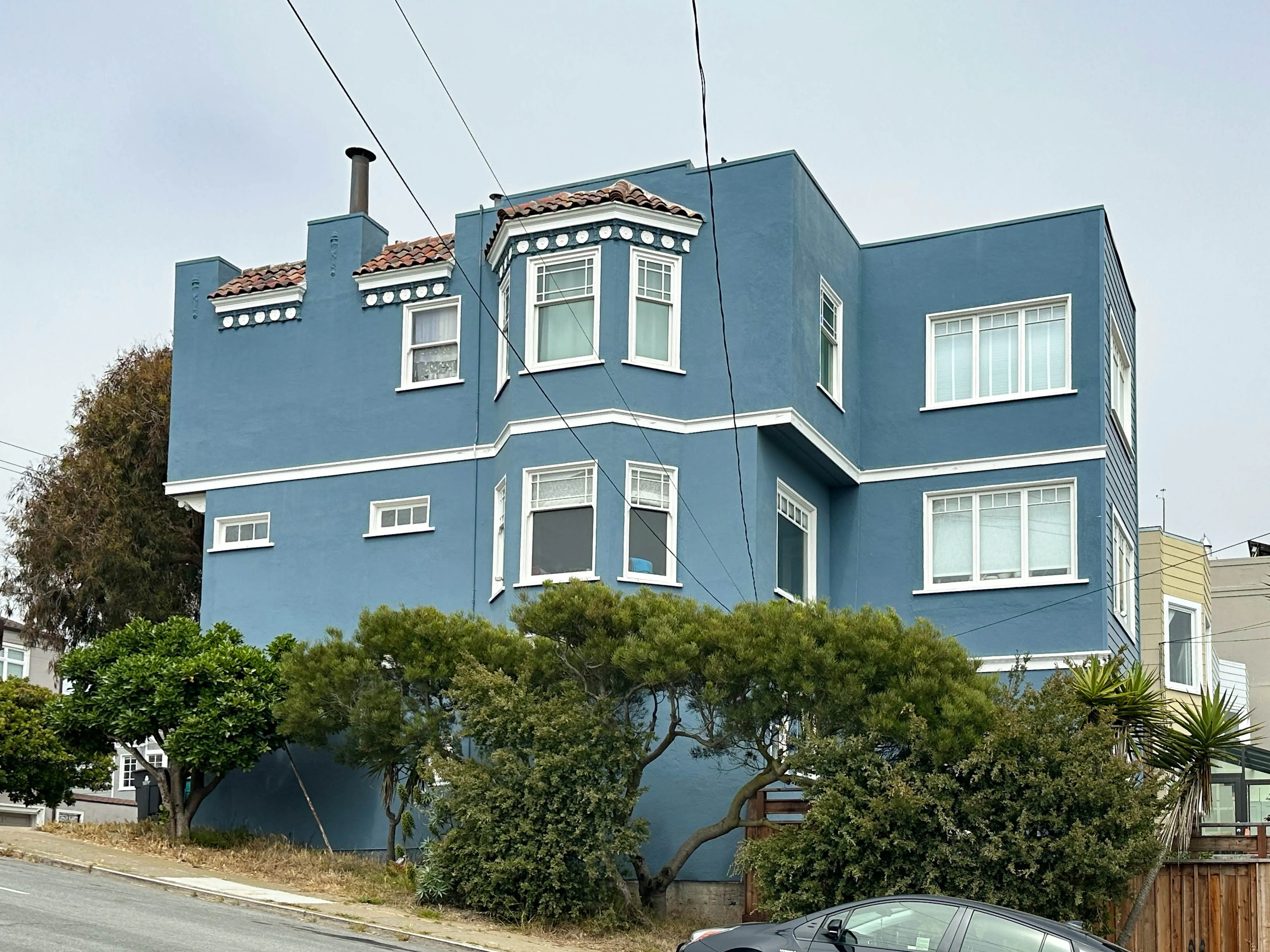 Picture of A freshly painted blue house stands proudly against the sky, its vibrant color a testament to Michael Sack Painting, Inc.'s commitment to quality outcomes. This striking transformation highlights the company's expertise and dedication to high customer satisfaction. Copyright ©2025 Diamond Certified Resource - Michael Sack Painting, Inc.