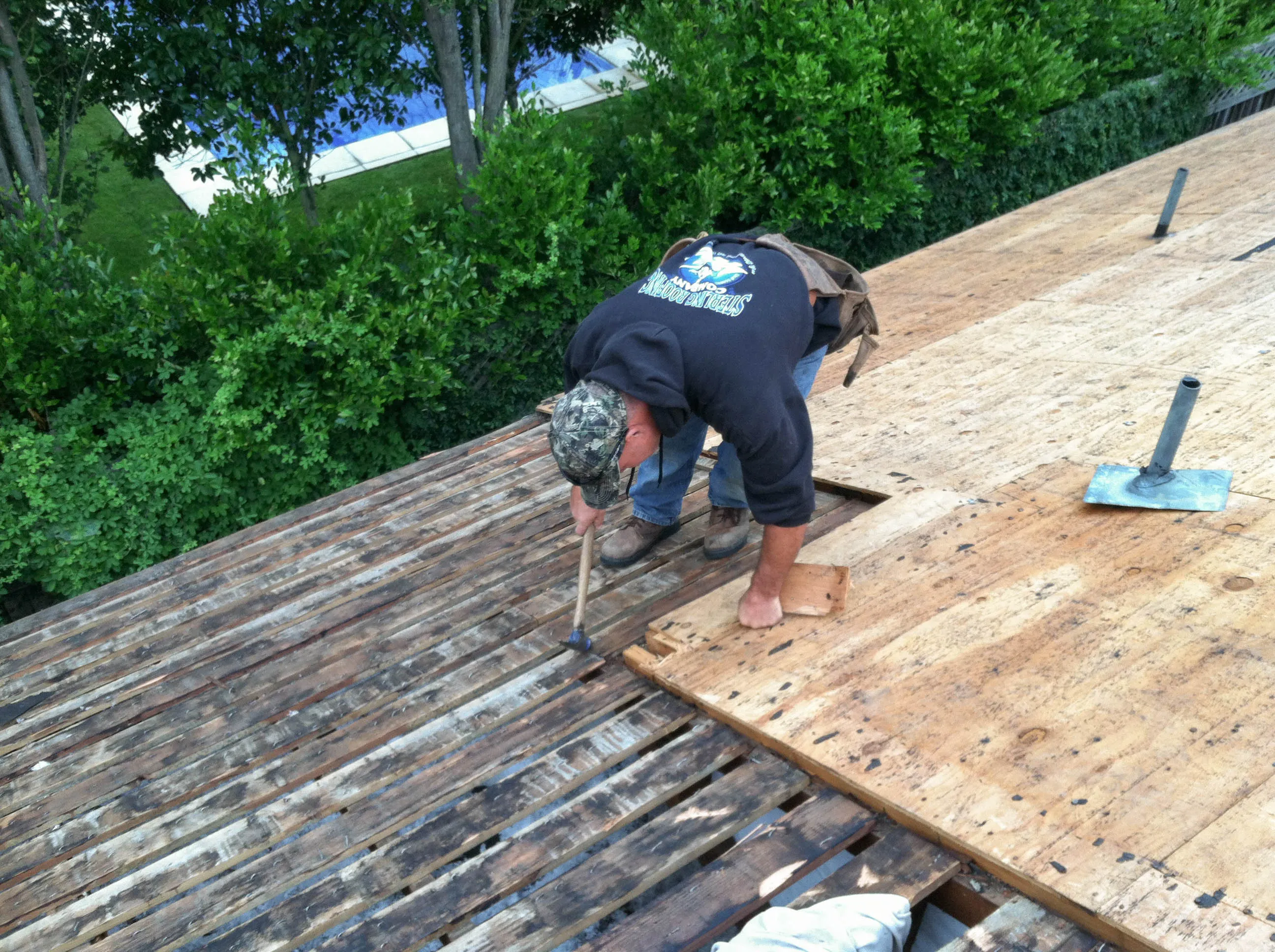 Picture of A dedicated craftsman from Sterling Roofing Co., Inc. meticulously replaces a section of aged roof decking, ensuring quality and durability. The companyâ€™s focus on quality outcomes shines through in every task. Copyright ©2025 Diamond Certified Resource

 - Sterling Roofing Co., Inc.