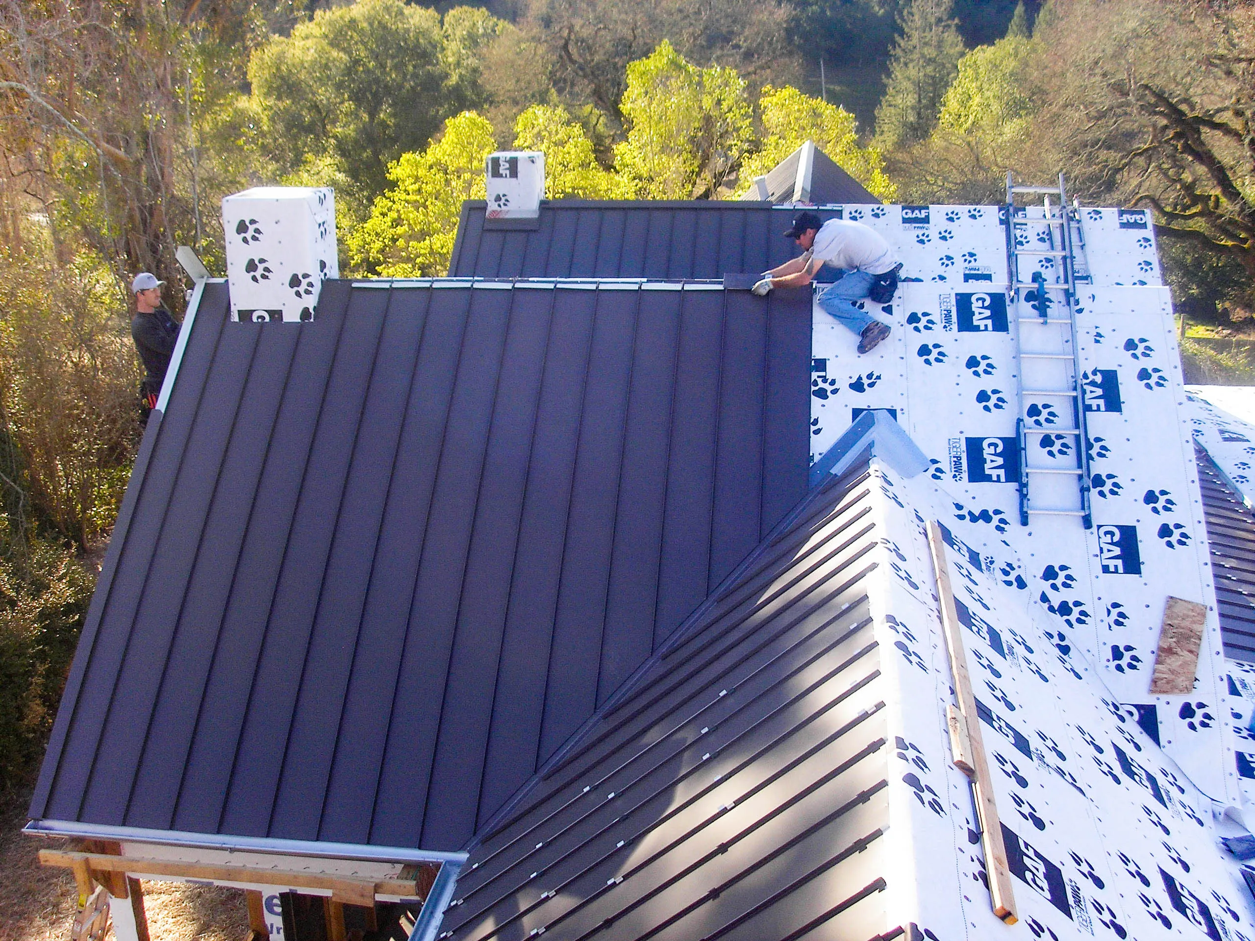 Picture of A skilled worker from Sterling Roofing Co., Inc. meticulously installs metal panels on a roof, ensuring precision and qualityâ€”a standard for which the company is renowned. Known for consistently achieving a Highest in Quality rating, Sterling Roofing Co., Inc. exemplifies excellence in every project. Copyright ©2025 Diamond Certified Resource

 - Sterling Roofing Co., Inc.