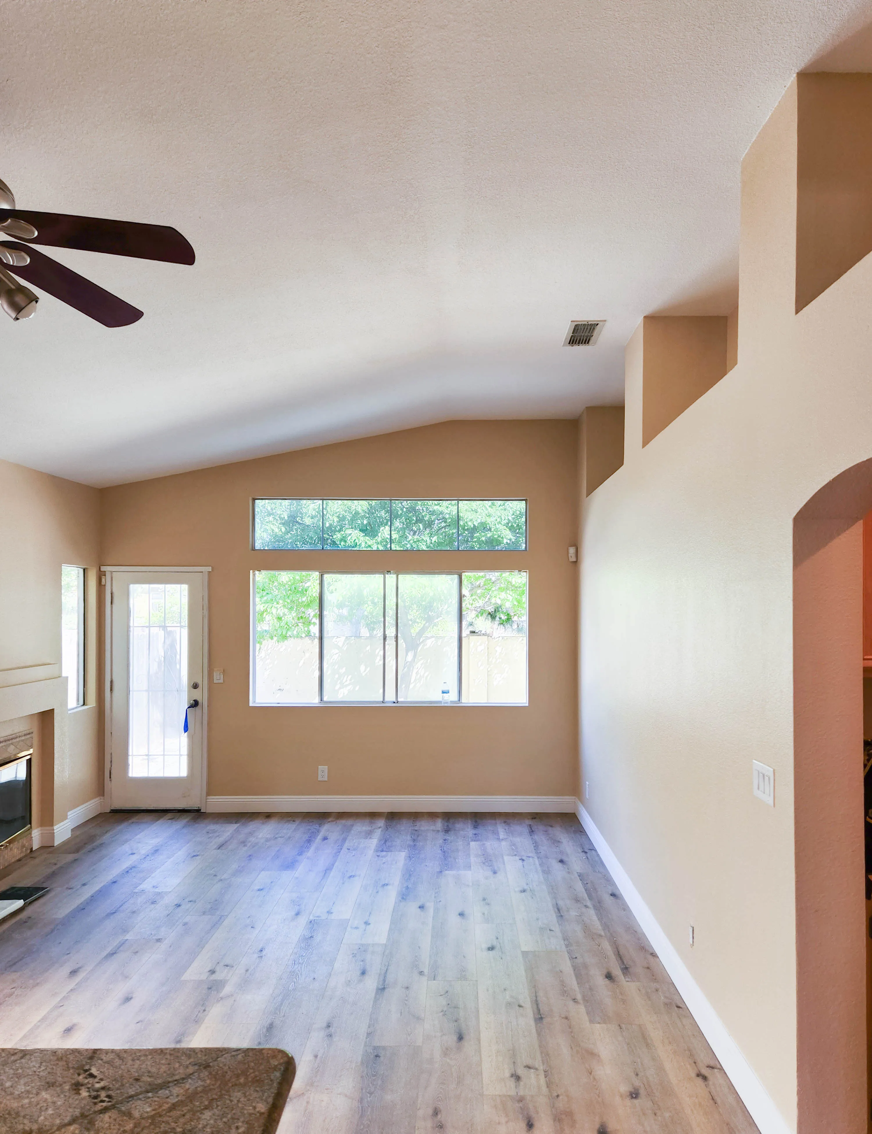 Picture of In a serene room with freshly painted walls and sleek wood flooring, Sulvaran Drywall captures a blend of simplicity and elegance, focusing on quality outcomes. The smooth finish tells a story of meticulous craftsmanship. Copyright ©2025 Diamond Certified Resource - Sulvaran Drywall