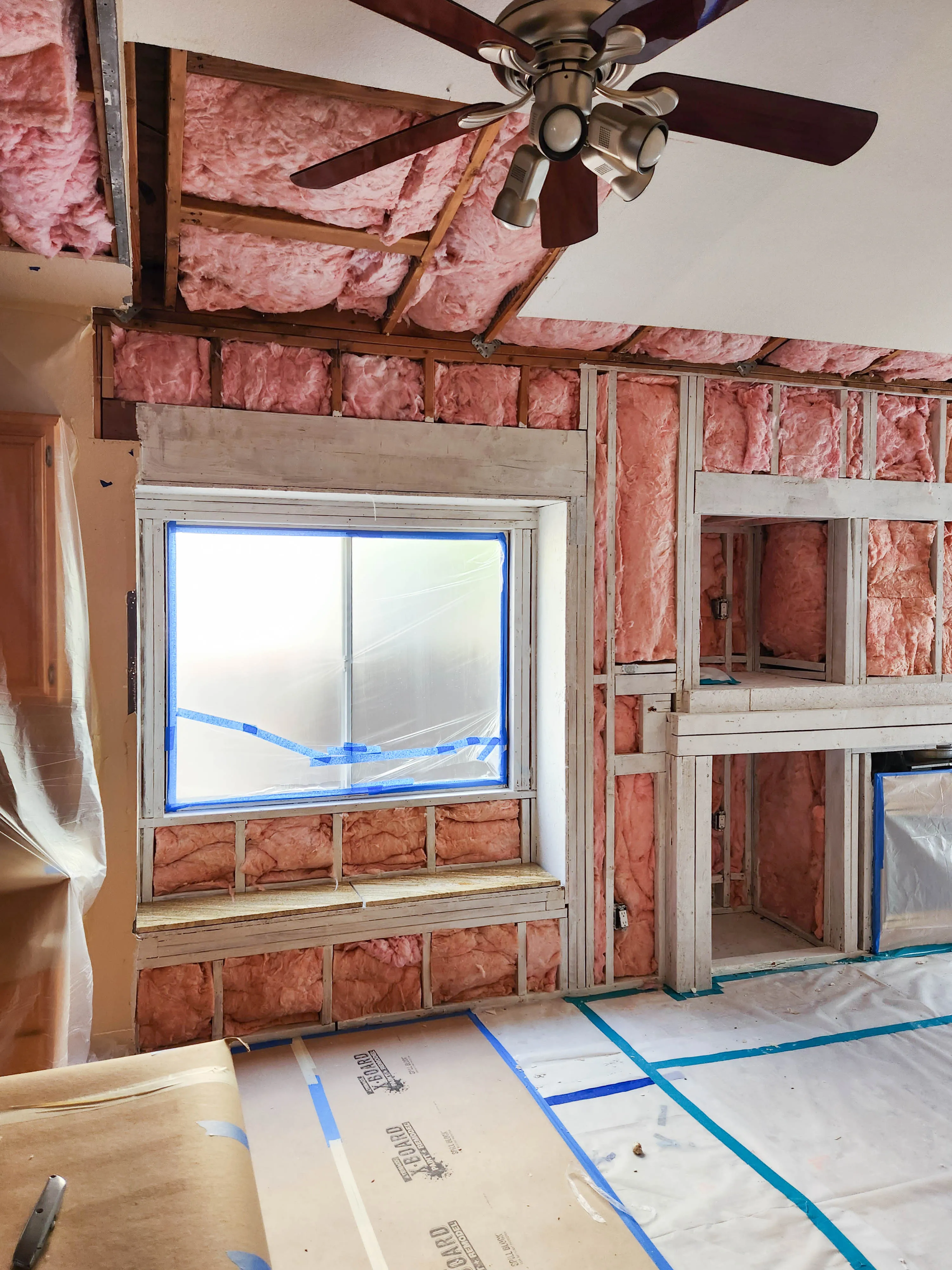 Picture of Amidst the exposed frame and pink insulation, Sulvaran Drywall transforms this room with precision and care, embodying their focus on quality outcomes. This attention to detail exemplifies why the company consistently achieves a Highest in Quality rating. Copyright ©2025 Diamond Certified Resource

 - Sulvaran Drywall