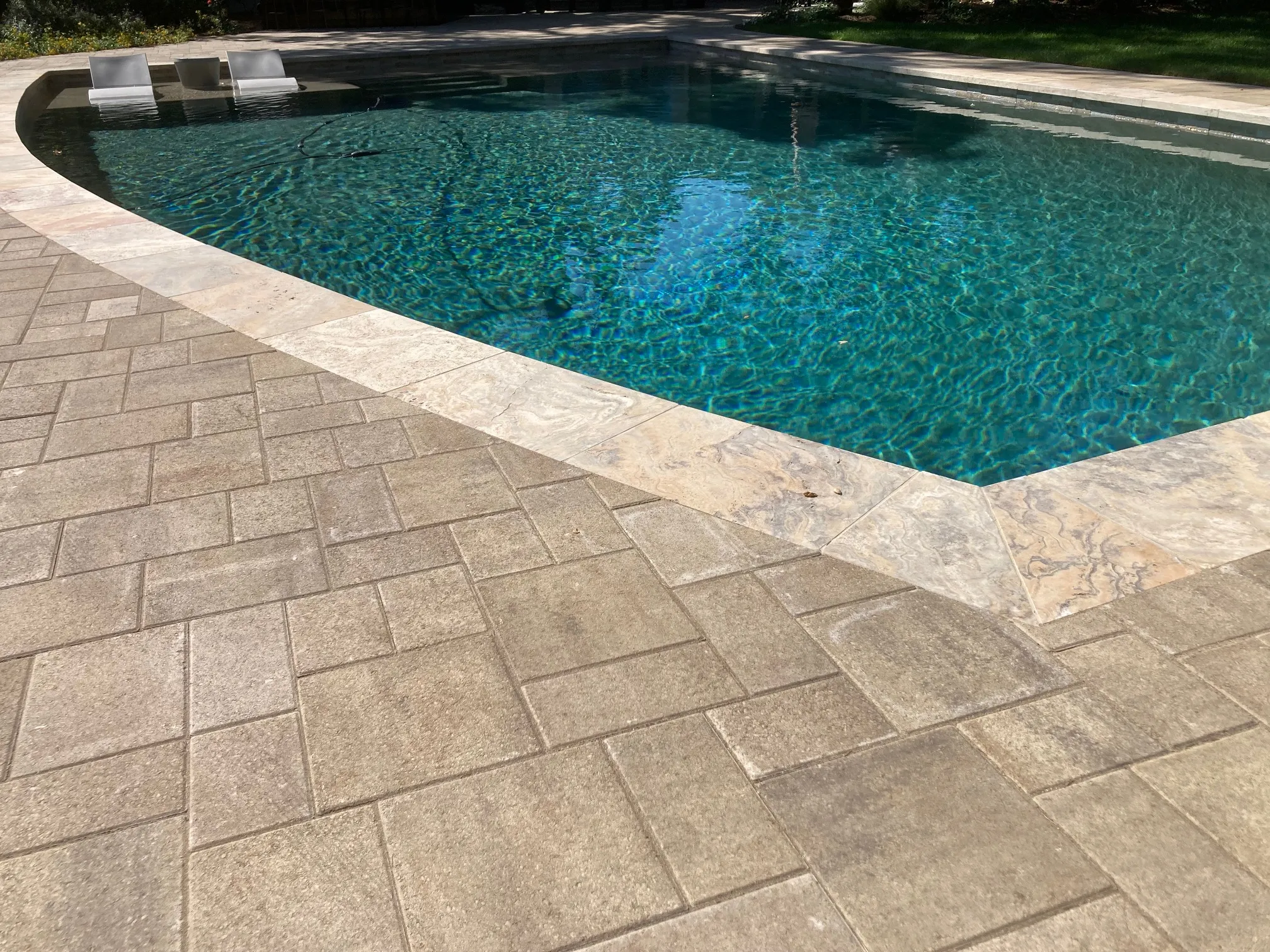 Picture of Serenity meets craftsmanship in a beautifully paved poolside, where The Legacy Paver Group's expertise in quality creates a perfect blend of elegance and functionality. Recognized for their expertise and quality, every detail reflects a commitment to excellence. Copyright ©2025 Diamond Certified Resource - The Legacy Paver Group