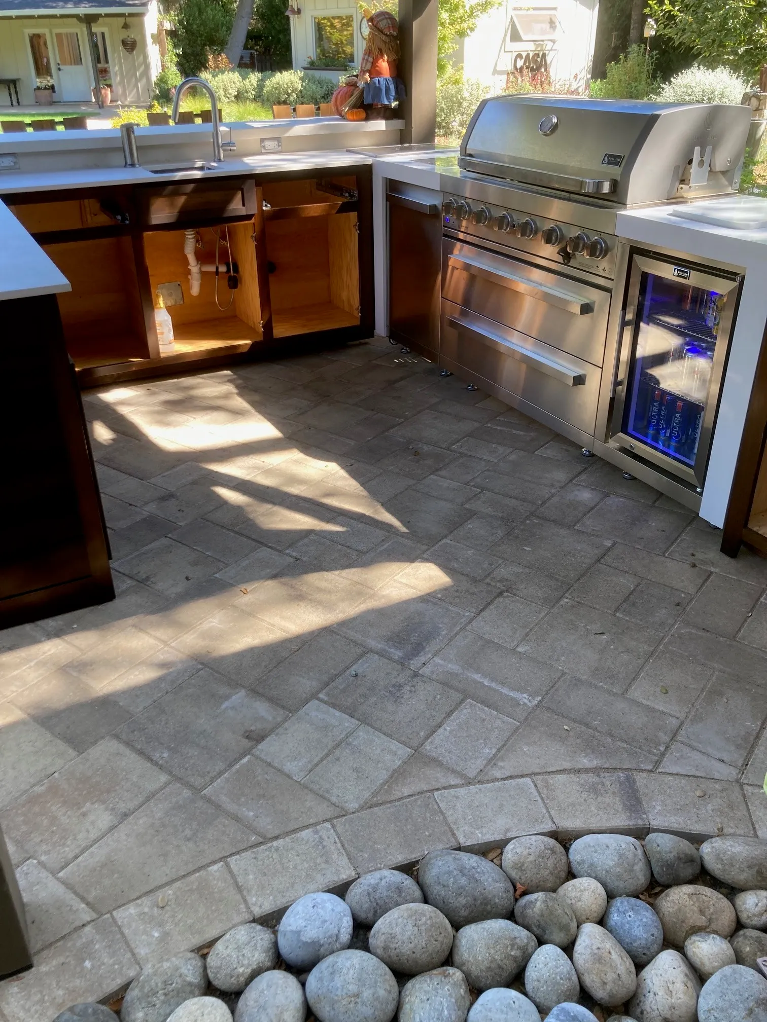 Picture of A serene outdoor kitchen setup with The Legacy Paver Groupâ€™s meticulous craftsmanship visible in the neatly laid pavers, harmonizing utility with aesthetic excellence. Recognized for expertise and quality, the company creates spaces that resonate with style and functionality. Copyright ©2025 Diamond Certified Resource

 - The Legacy Paver Group