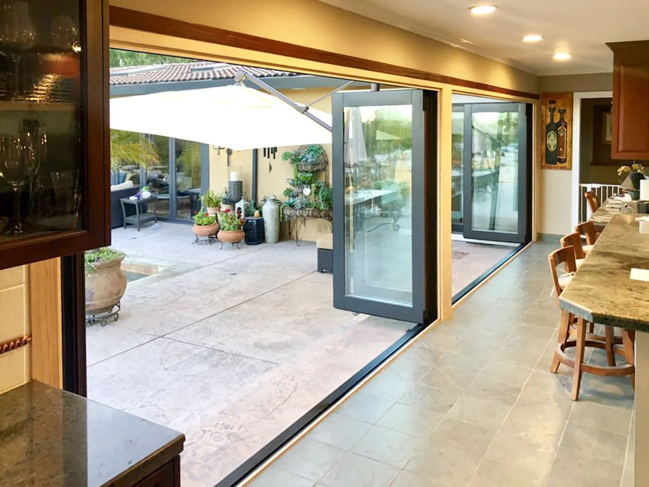 Picture of A seamless transition from indoors to outdoors, highlighted by elegant folding glass doors installed by Abstract Windows. This design not only enhances visual openness but also reflects the company's focus on quality outcomes. Copyright ©2025 Diamond Certified Resource

 - Abstract Windows