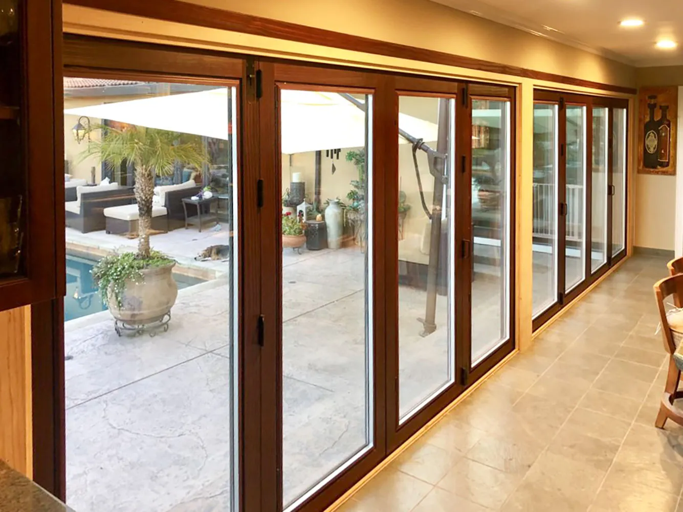 Picture of The elegant patio view through Abstract Windows' high-quality sliding doors highlights the seamless connection between indoor comfort and outdoor tranquility. Recognized for expertise and quality, Abstract Windows transforms spaces with precision. Copyright ©2025 Diamond Certified Resource

 - Abstract Windows