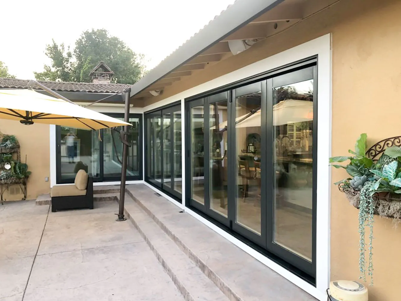 Picture of A serene patio scene showcases the sleek, modern sliding glass doors installed by Abstract Windows, inviting natural light into the home while maintaining privacy. Recognized for expertise and quality, the company ensures every detail enhances the living space. Copyright ©2025 Diamond Certified Resource

 - Abstract Windows
