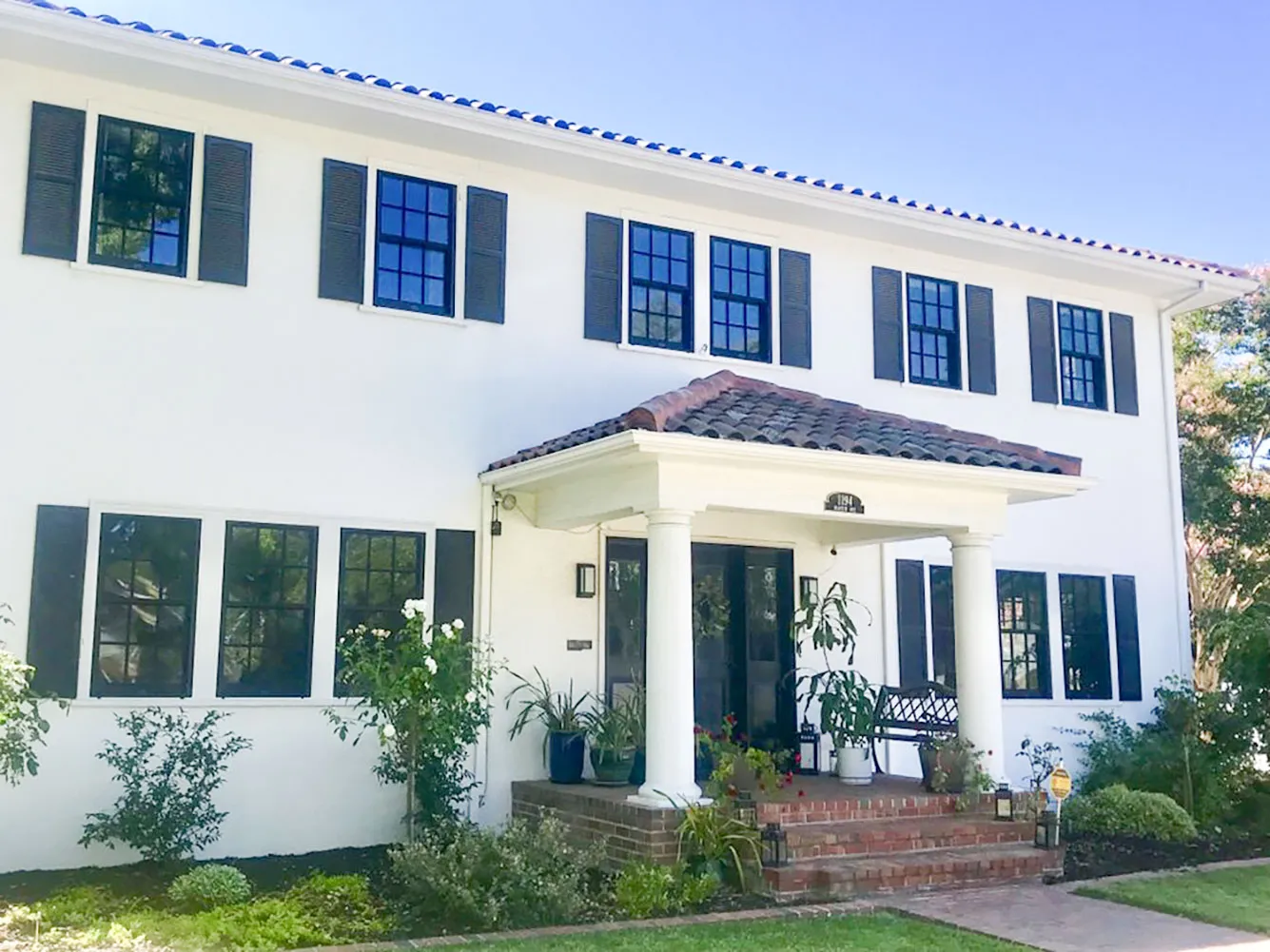 Picture of The timeless elegance of this pristine white home is enhanced by the sleek, dark-framed windows installed by Abstract Windows. Known for high customer satisfaction ratings, the company adds a touch of modernity to classic architecture. Copyright ©2025 Diamond Certified Resource - Abstract Windows