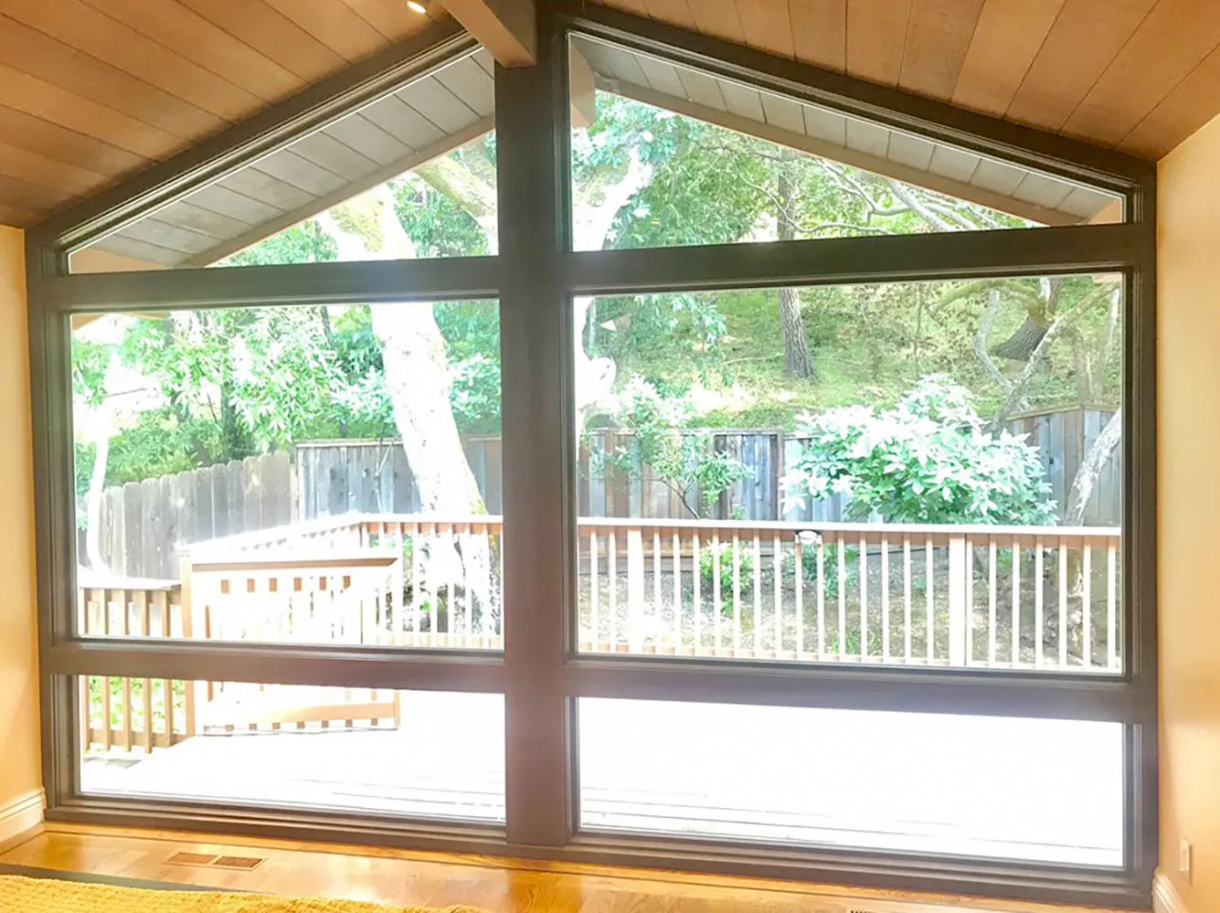 Picture of Sunlight streams through the large, geometric window installed by Abstract Windows, bringing the outdoors in and enhancing the natural warmth of the room. Abstract Windows focuses on quality outcomes, consistently achieving a Highest in Quality rating. Copyright ©2025 Diamond Certified Resource

 - Abstract Windows