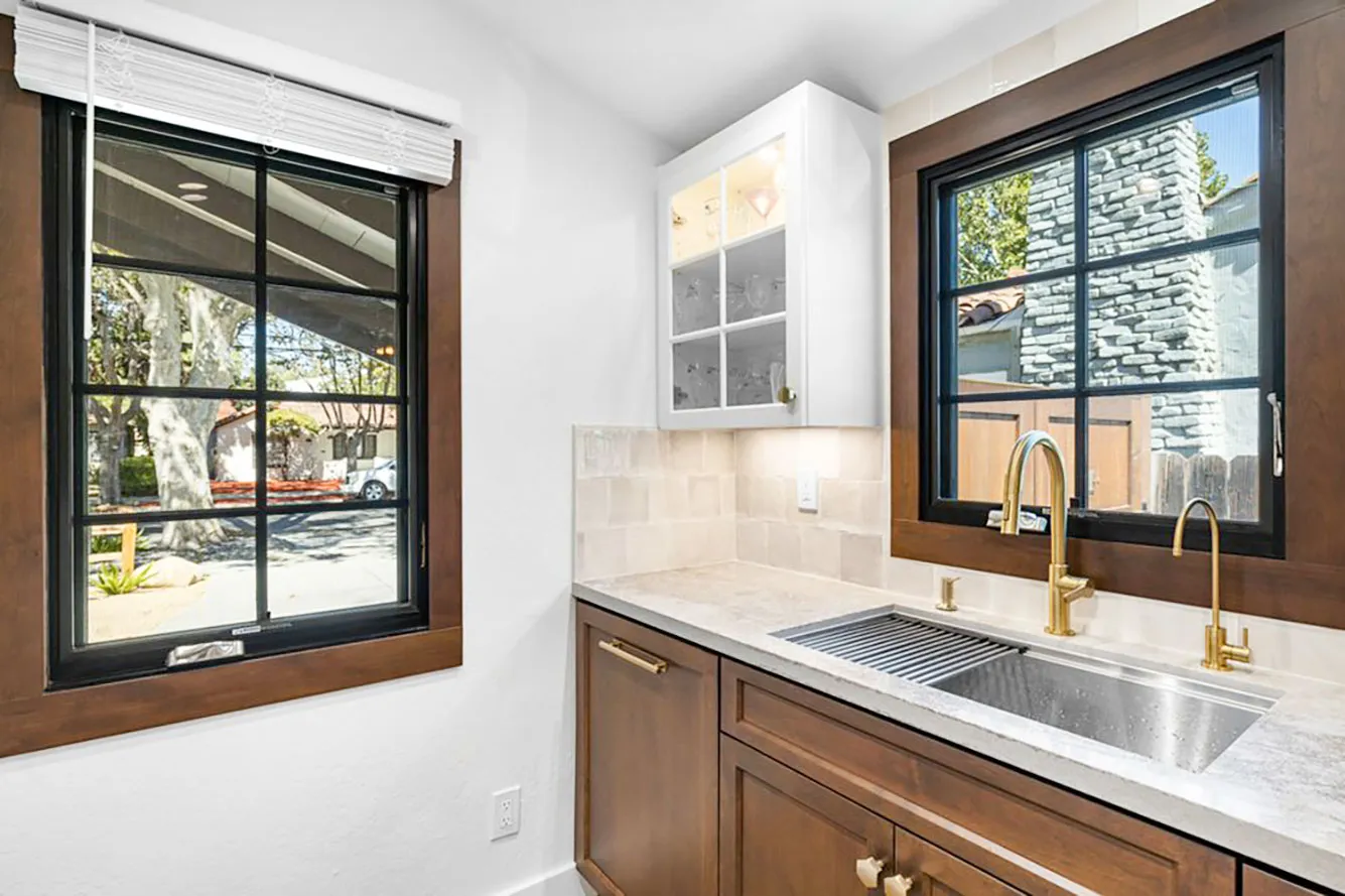 Picture of The serene elegance of a kitchen corner with contrasting dark-framed windows by Abstract Windows hints at the mastery of blending functionality and style. Known for high customer satisfaction ratings, this company excels in creating quality spaces that transform daily life. Copyright ©2025 Diamond Certified Resource - Abstract Windows