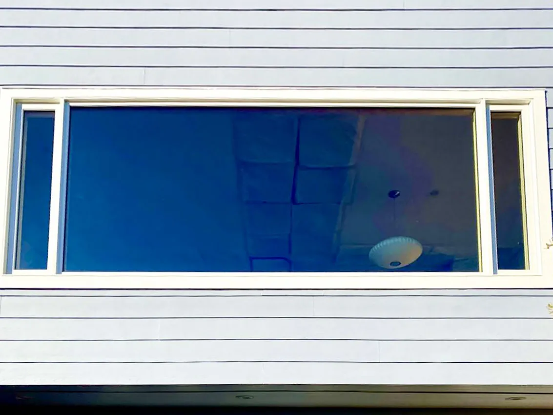Picture of A sleek, modern window installation by Abstract Windows showcases their commitment to quality outcomes. The reflection of the sky hints at an expansive exterior view, echoing the companyâ€™s dedication to high customer satisfaction ratings. Copyright ©2025 Diamond Certified Resource

 - Abstract Windows