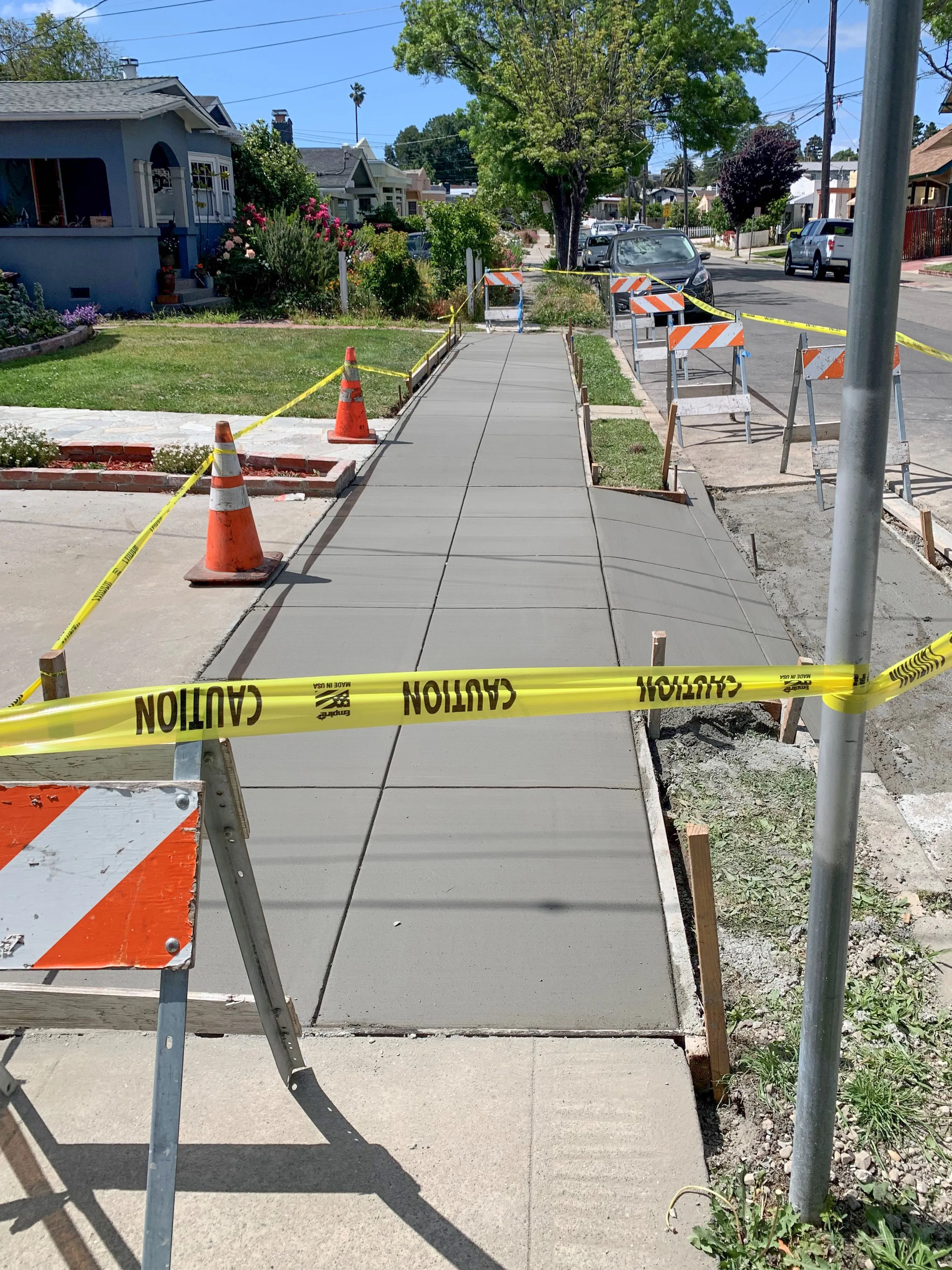 Picture of A freshly poured concrete sidewalk, marked off with caution tape, signifies ARP Hardscape's commitment to quality outcomes. The meticulous work enhances the neighborhood's aesthetics, reflecting the company's focus on quality outcomes. Copyright ©2025 Diamond Certified Resource

 - ARP Hardscape