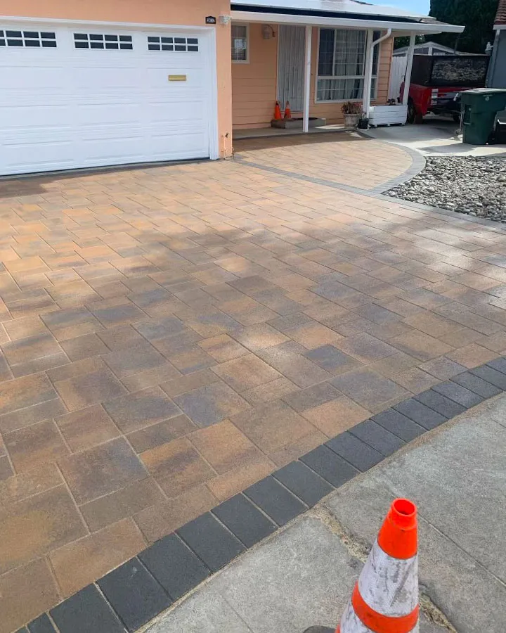 Picture of A meticulously laid driveway showcases ARP Hardscape's commitment to quality outcomes. The uniformity of the pavers hints at the expertise behind this transformation, reflecting the companyâ€™s focus on high customer satisfaction ratings. Copyright ©2025 Diamond Certified Resource

 - ARP Hardscape