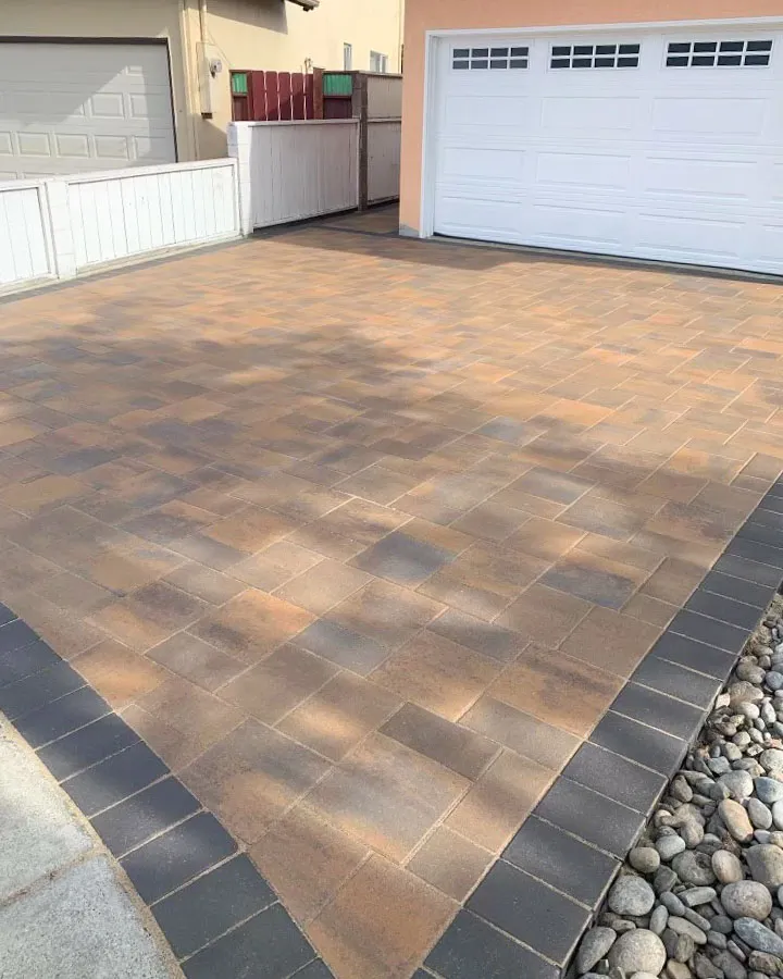 Picture of A newly paved driveway by ARP Hardscape showcases meticulous craftsmanship with crisp edges and a seamless blend of colors. Known for consistently achieving a Highest in Quality rating, ARP Hardscape transforms ordinary spaces into exceptional landscapes. Copyright ©2025 Diamond Certified Resource

 - ARP Hardscape