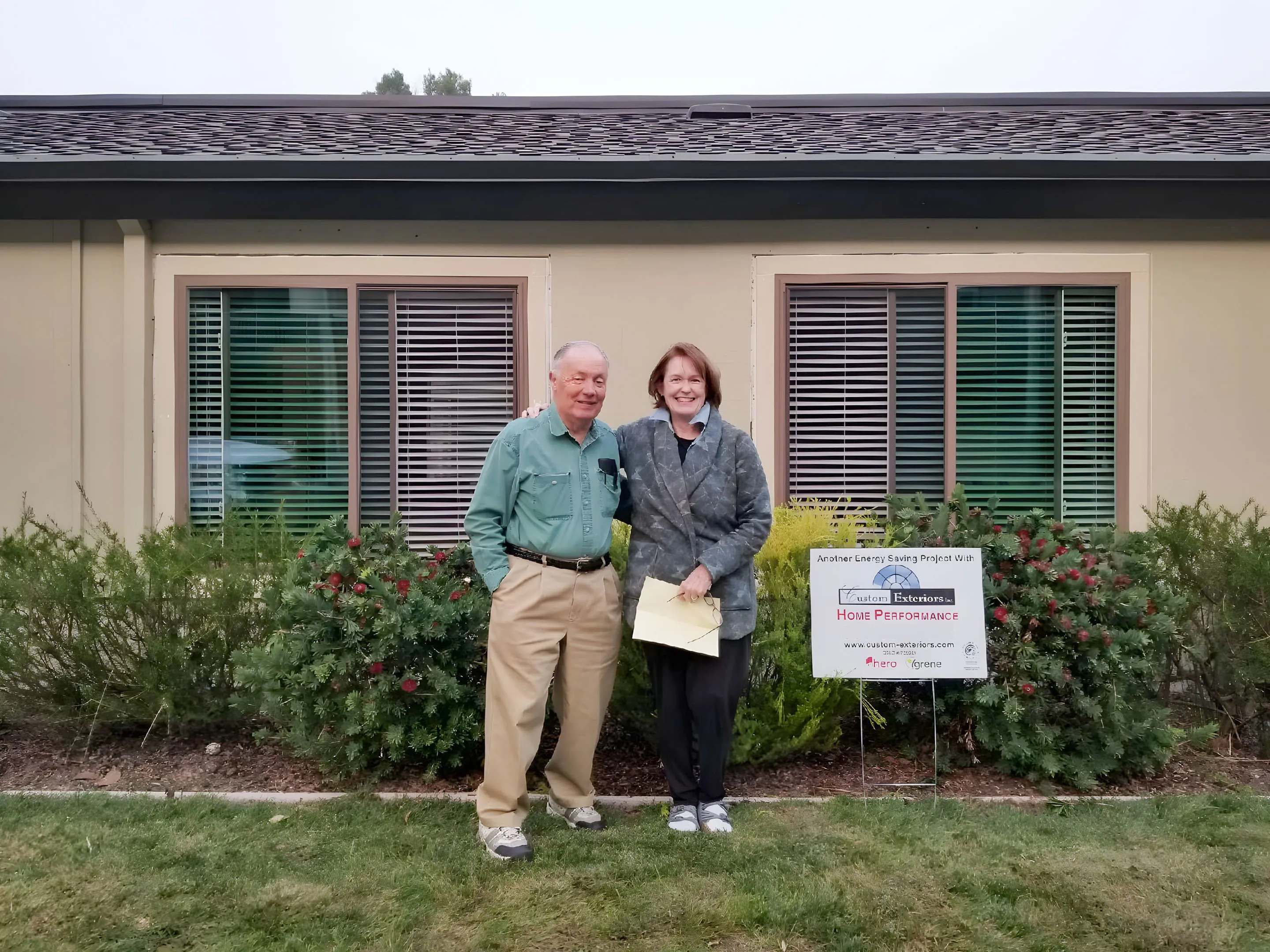 Picture of A satisfied couple stands before their newly enhanced home, showcasing Custom Exteriors, Inc.'s commitment to quality outcomes. Their smiles reflect the company's high customer satisfaction ratings. Copyright ©2025 Diamond Certified Resource

 - Custom Exteriors, Inc.