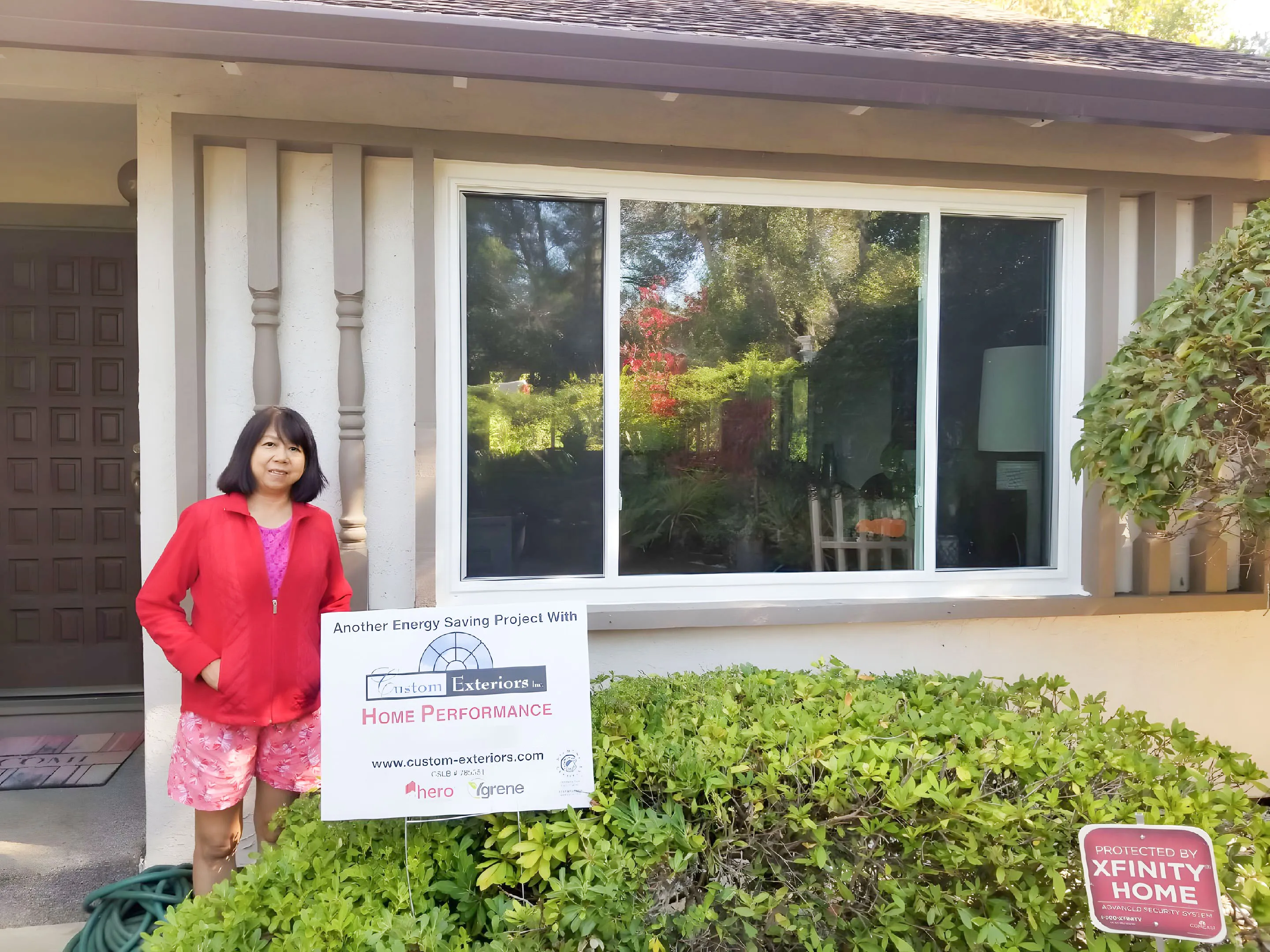 Picture of A homeowner stands beside a newly installed energy-efficient window, a testament to Custom Exteriors, Inc.'s commitment to quality outcomes. The project enhances aesthetics and efficiency. Copyright ©2025 Diamond Certified Resource

 - Custom Exteriors, Inc.