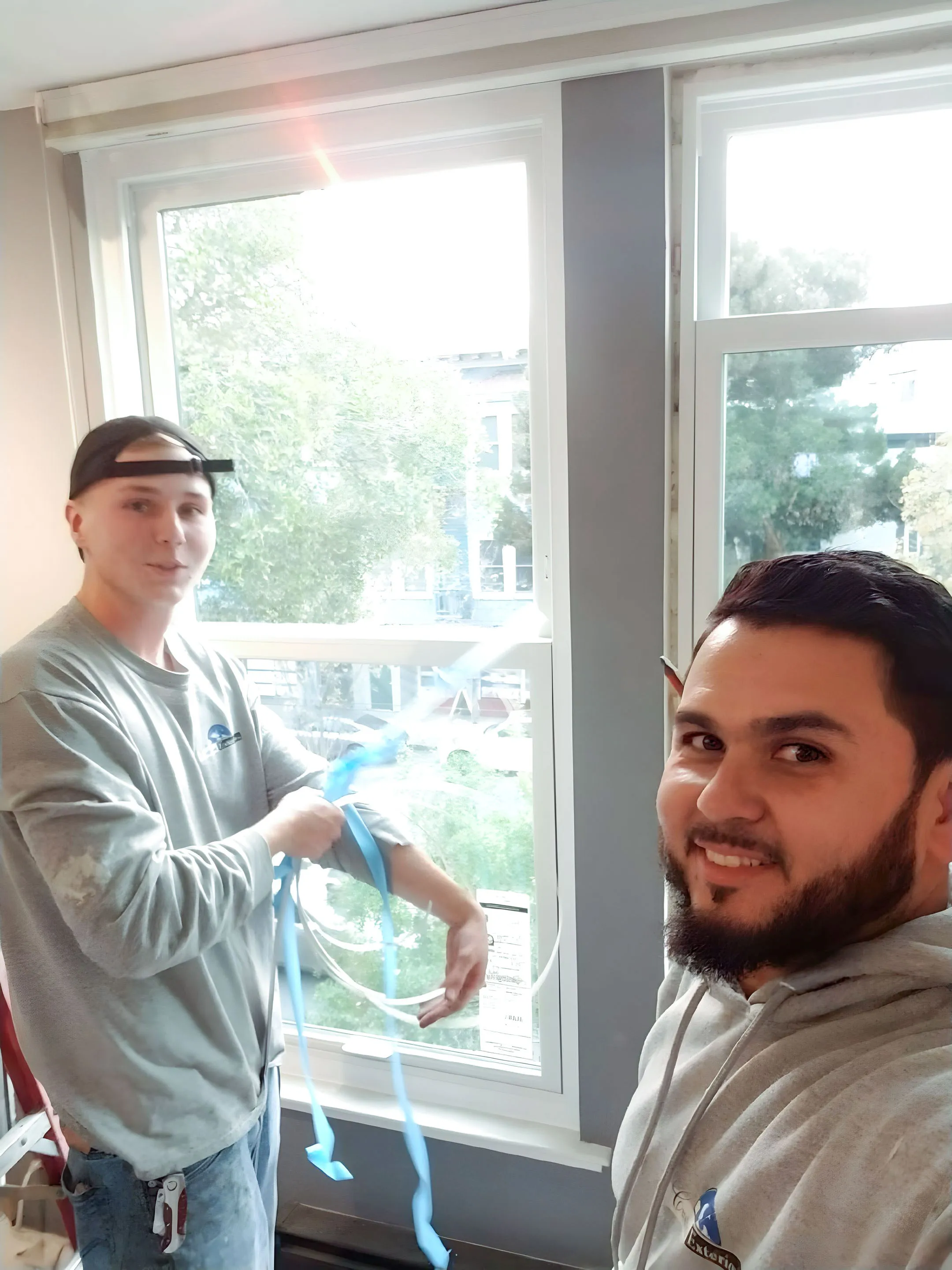 Picture of Two team members from Custom Exteriors, Inc. work meticulously on a window replacement, showcasing their focus on quality outcomes. The attention to detail reflects why the company is recognized for expertise and quality. Copyright ©2025 Diamond Certified Resource

 - Custom Exteriors, Inc.