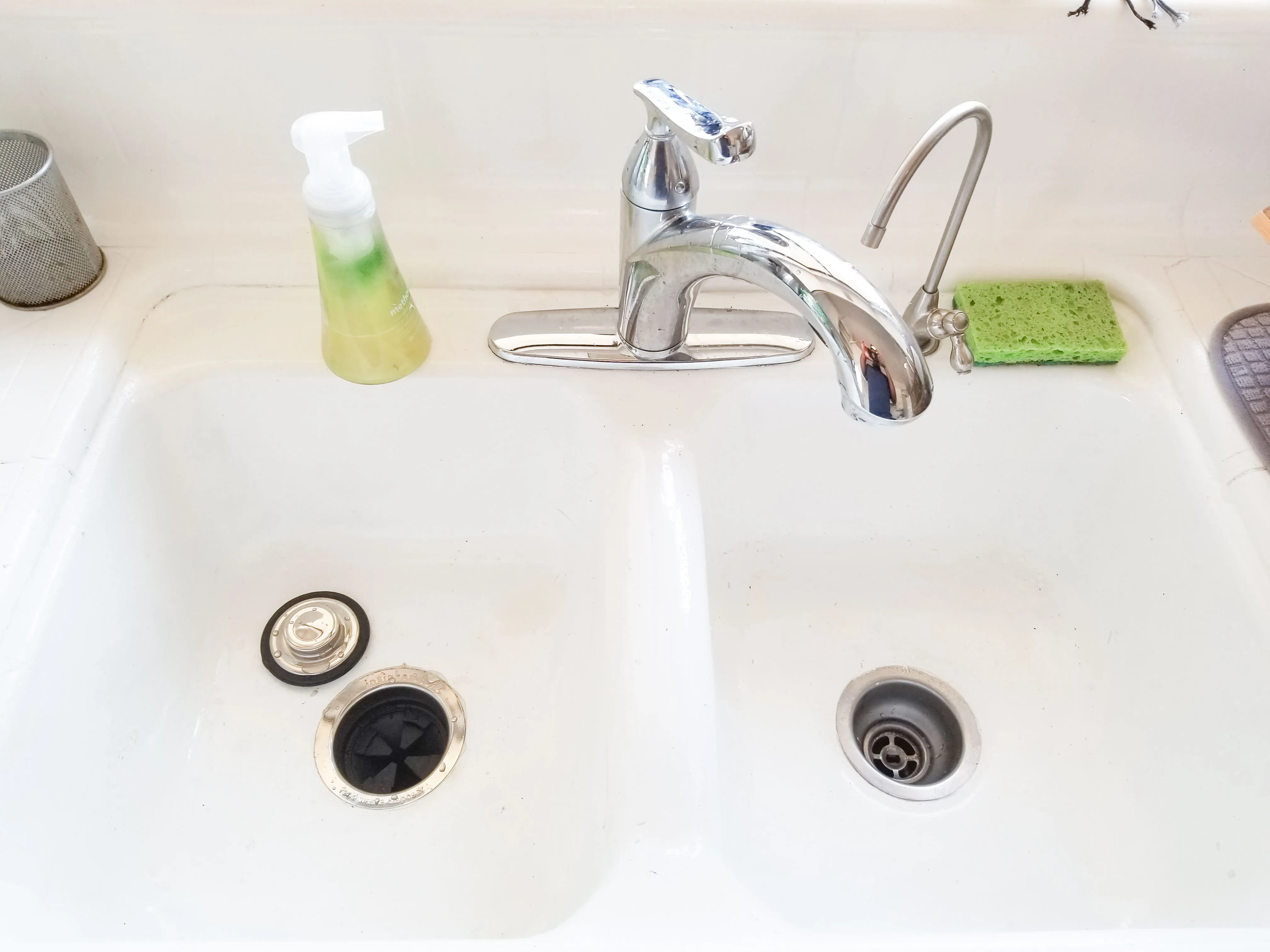 Picture of The pristine dual-basin sink, complete with a sleek chrome faucet and a touch of green from a dish sponge, reflects Gray Plumbing Inc's commitment to quality outcomes. This installation exemplifies their top-rated service for Quality. Copyright ©2025 Diamond Certified Resource

 - Gray Plumbing Inc