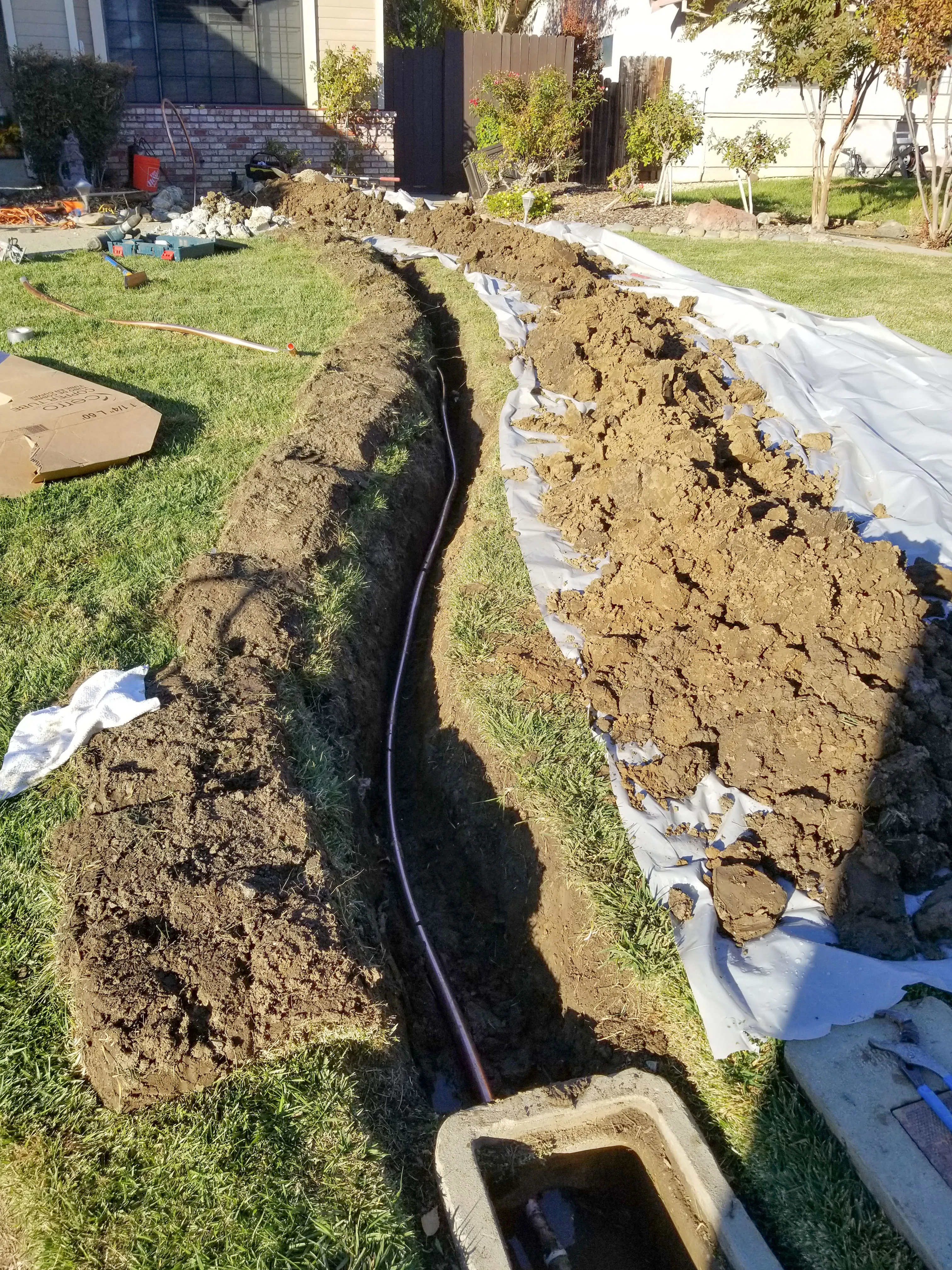 Picture of A freshly dug trench reveals meticulous groundwork by Gray Plumbing Inc, showcasing their focus on quality outcomes. The careful placement of piping hints at the expert precision the company is known for. Copyright ©2025 Diamond Certified Resource

 - Gray Plumbing Inc
