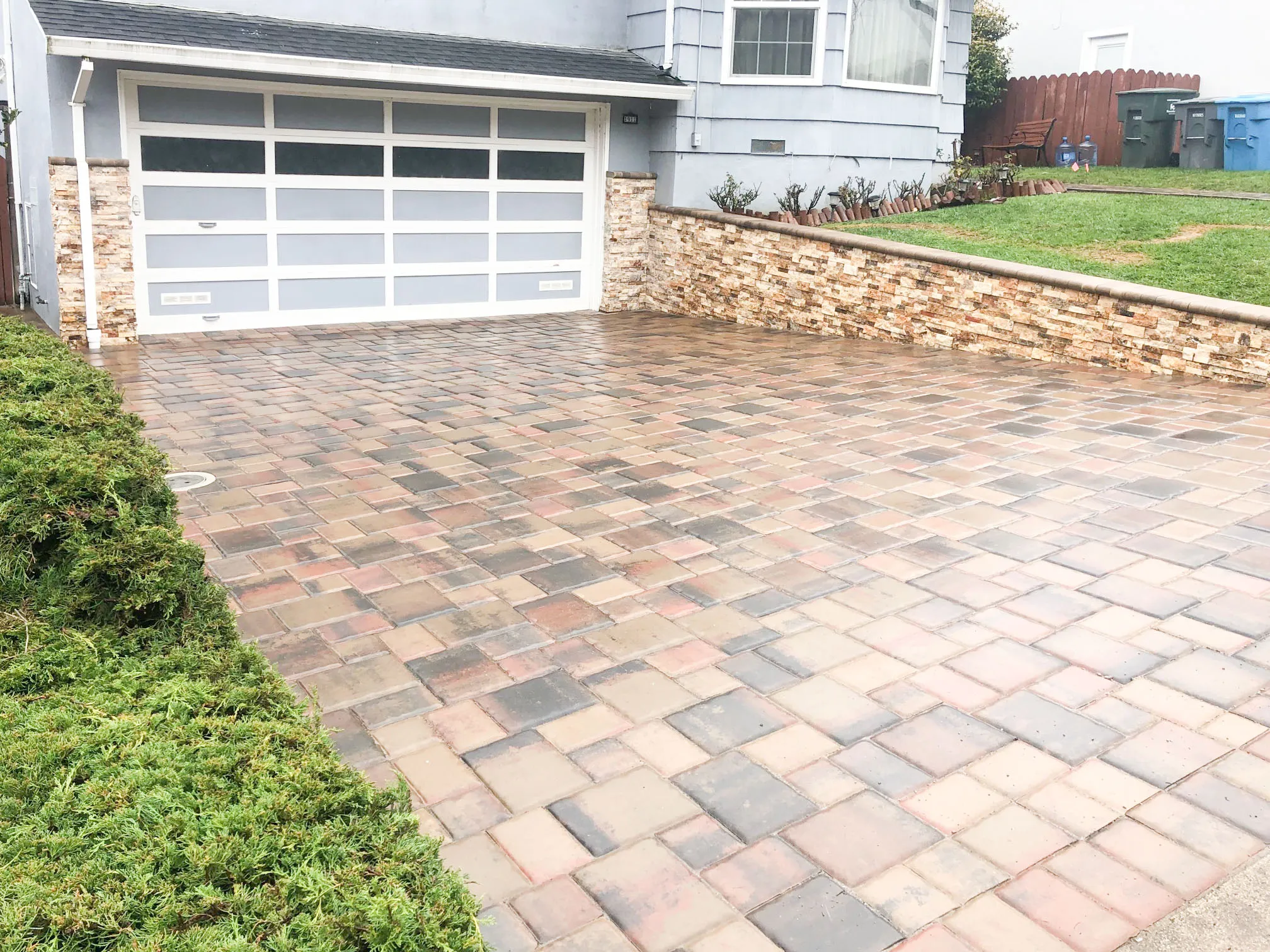 Picture of A meticulously crafted stone driveway by Mr. Pavers Contractor Services, Inc. reveals an intricate pattern leading to a pristine garage, highlighting the company's focus on quality outcomes. Copyright ©2025 Diamond Certified Resource

 - Mr. Pavers Contractor Services, Inc.