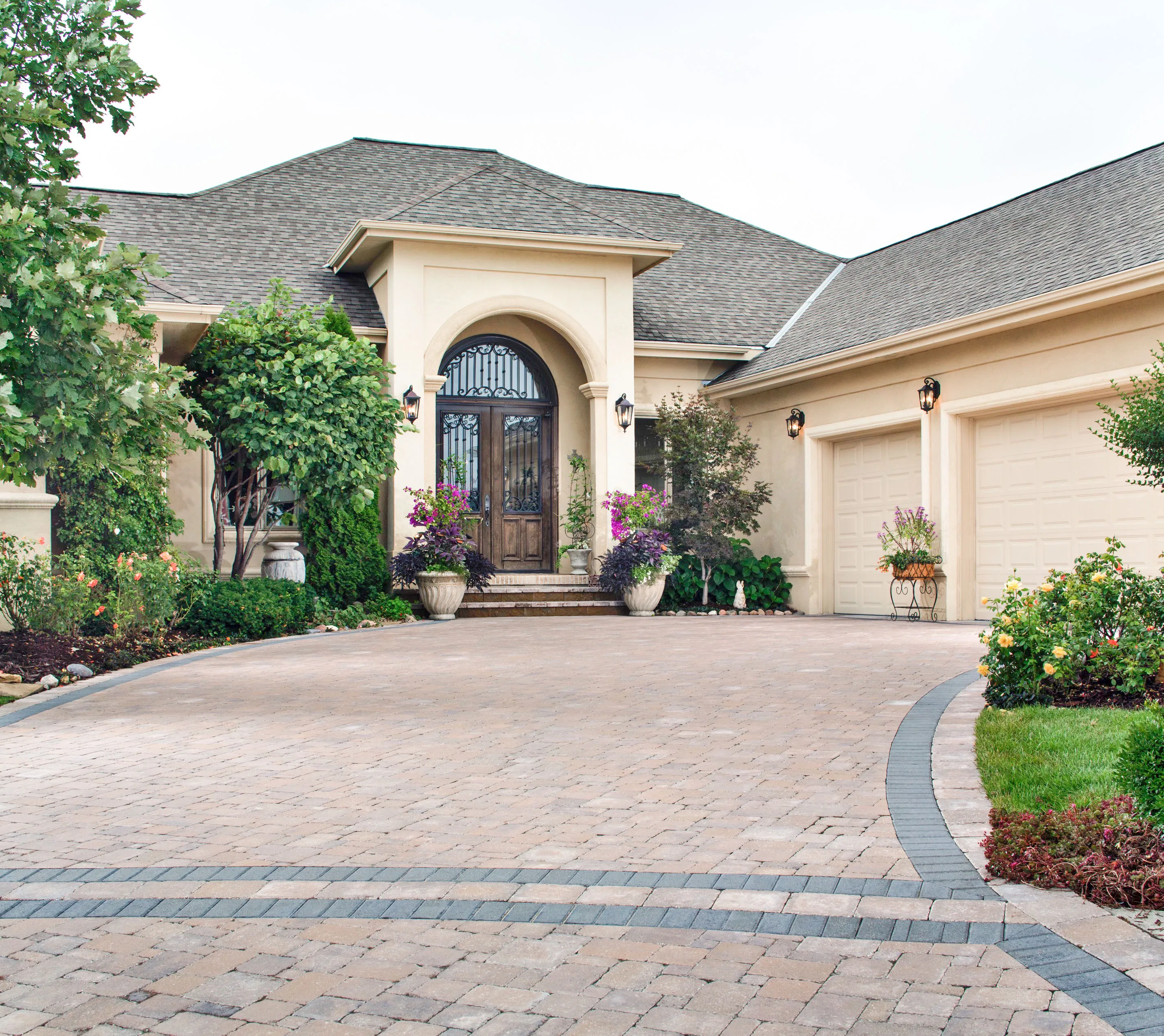 Picture of The meticulously arranged paver driveway leads gracefully to a grand entrance, showcasing Mr. Pavers Contractor Services, Inc.'s focus on quality outcomes. The artistry of their work enhances the inviting curb appeal. Copyright ©2025 Diamond Certified Resource

 - Mr. Pavers Contractor Services, Inc.