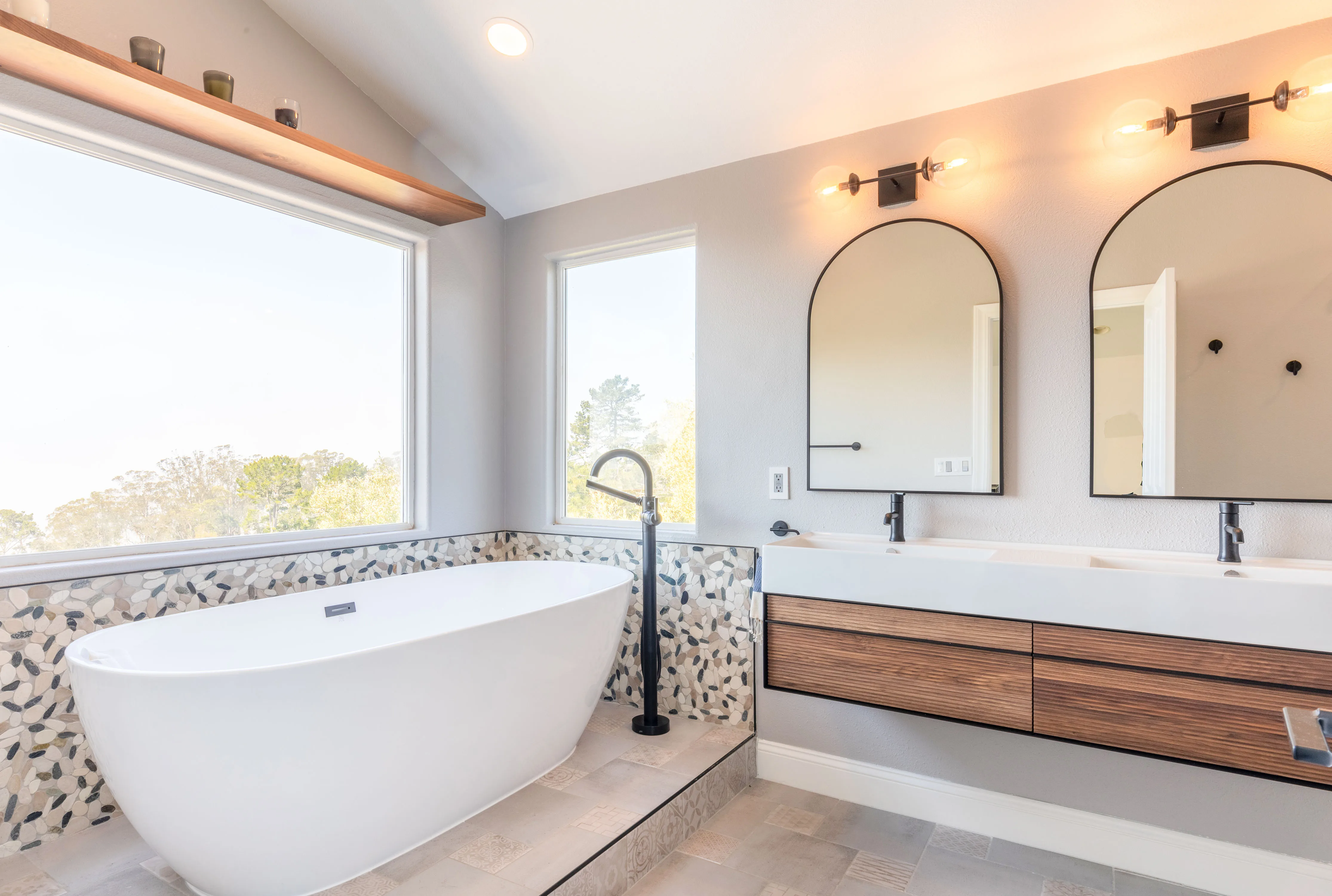 Picture of In the serene light of a newly remodeled bathroom, NuHome Remodeling's focus on quality outcomes is evident in the elegant freestanding tub and modern fixtures. This space exemplifies the company's commitment to high customer satisfaction ratings. Copyright ©2025 Diamond Certified Resource - NuHome Remodeling