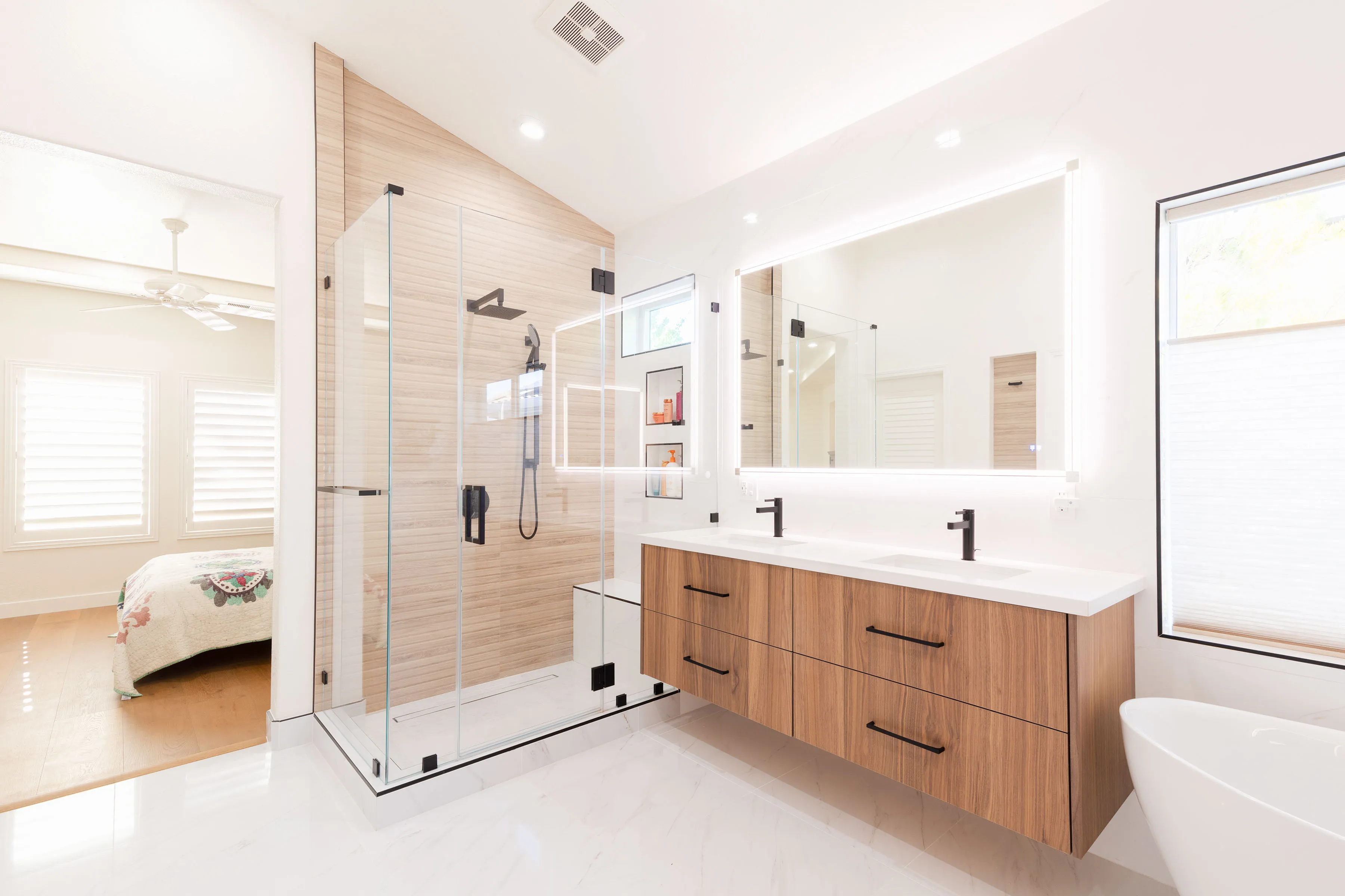 Picture of In this serene bathroom, NuHome Remodeling showcases its expertise with a sleek glass shower and wood-accented vanity. Recognized for expertise and quality, they elevate every space. Copyright ©2025 Diamond Certified Resource - NuHome Remodeling