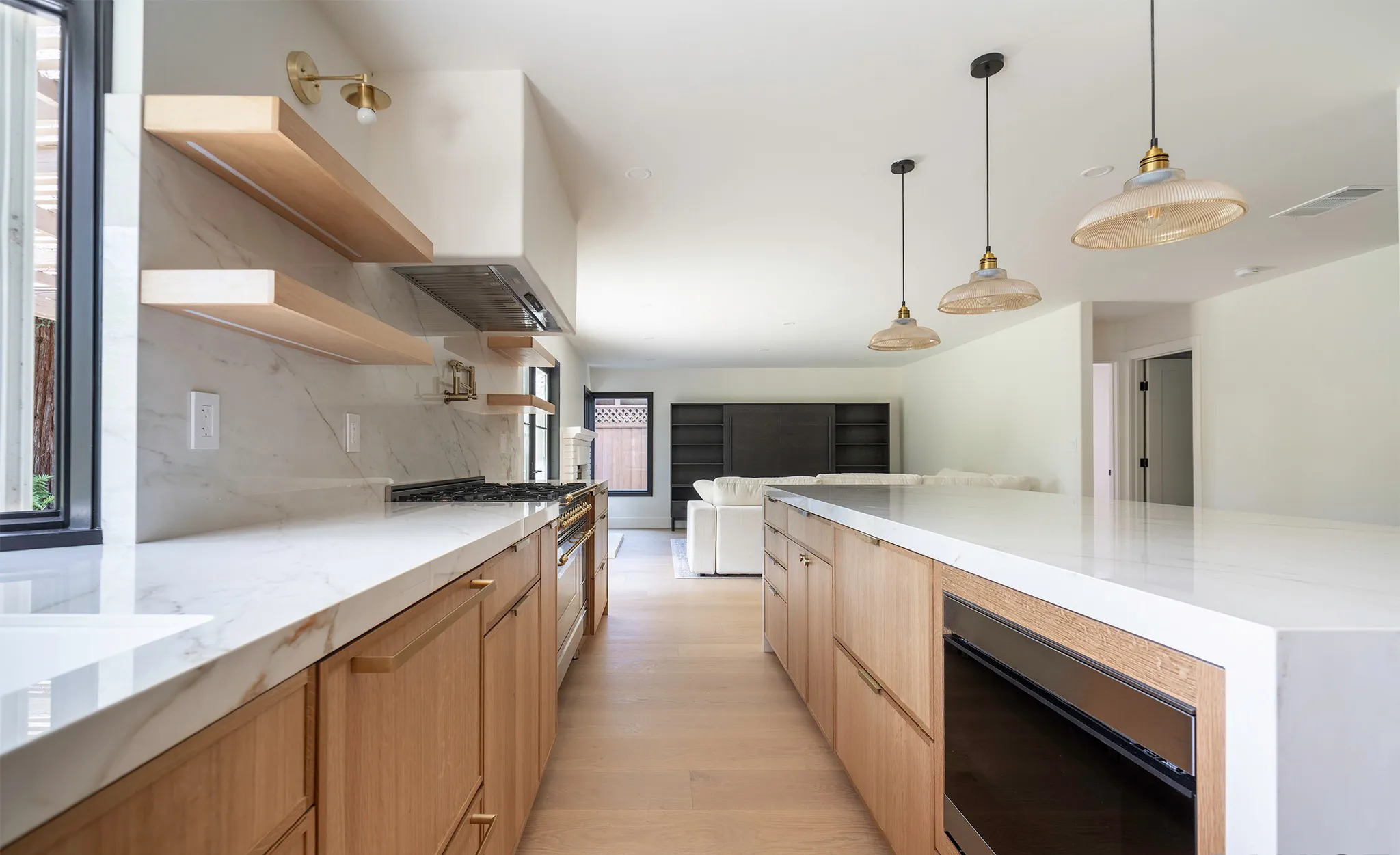 Picture of A seamless blend of function and style unfolds in this modern kitchen renovation by Wise Builders Remodeling, Inc. The sleek marble countertops and minimalist open shelving epitomize quality craftsmanship. Recognized for expertise and quality, Wise Builders continually transforms spaces into functional art. Copyright ©2025 Diamond Certified Resource

 - Wise Builders Remodeling, Inc.