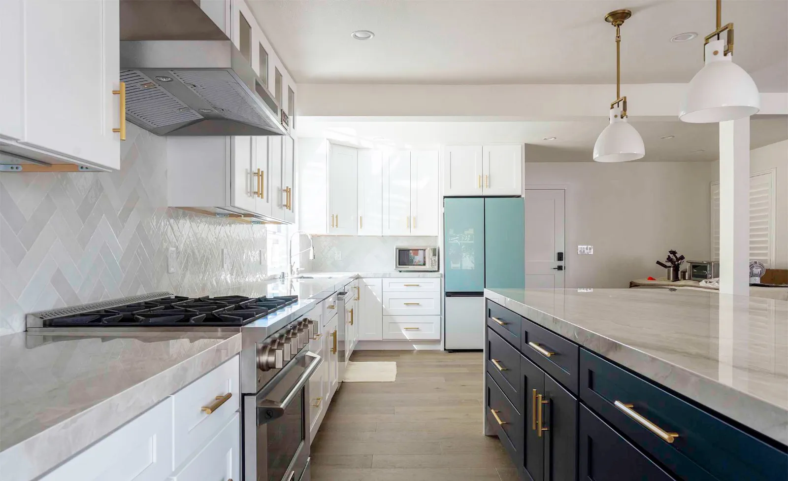 Picture of In this elegantly remodeled kitchen, the seamless blend of light and dark cabinetry showcases Wise Builders Remodeling, Inc.'s focus on quality outcomes. The sleek design echoes the companyâ€™s high customer satisfaction ratings. Copyright ©2025 Diamond Certified Resource

 - Wise Builders Remodeling, Inc.