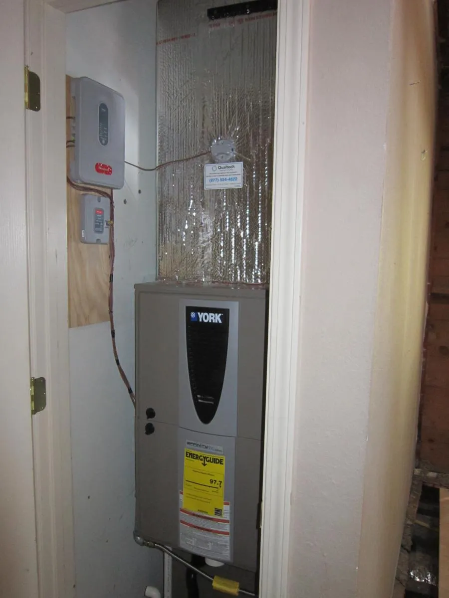 Picture of In a neatly organized utility closet, a York heating unit installed by Qualtech Heating & Cooling showcases the company's focus on quality outcomes, ensuring efficient home climate control. Copyright ©2025 Diamond Certified Resource

 - Qualtech Heating & Cooling