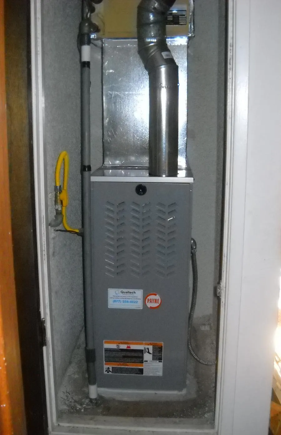 Picture of Tucked neatly within a closet, a well-installed heating unit showcases Qualtech Heating & Coolingâ€™s commitment to quality outcomes. The attention to detail reflects their focus on achieving high customer satisfaction ratings. Copyright ©2025 Diamond Certified Resource

 - Qualtech Heating & Cooling