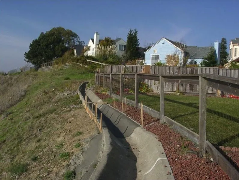 Picture of  Nestled against a serene suburban backdrop, a precise drainage installation by Engineered Soil Repairs, Inc. showcases their signature quality outcomes, ensuring stability and beauty. Copyright ©2025 Diamond Certified Resource.

 - Engineered Soil Repairs, Inc.