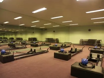 Picture of At Prime Time Athletic Club, an empty Pilates studio reflects dedication to quality outcomes, inviting members to enhance their well-being. Known for its expertise and quality, the club fosters a space for personal growth. Copyright ©2025 Diamond Certified Resource - Prime Time Athletic Club