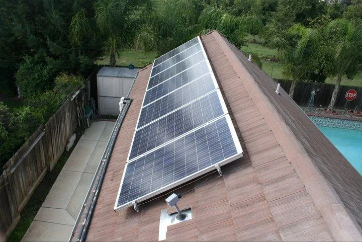 Picture of Sunlit solar panels line a residential roof, reflecting Quality First Home Improvement, Inc.'s commitment to sustainable energy solutions. The company consistently achieved a Highest in Quality rating. Copyright ©2025 Diamond Certified Resource. - Quality First Home Improvement, Inc.