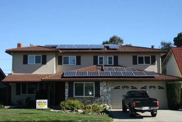 Picture of  A suburban home showcases solar panels installed seamlessly on its roof, a testament to Quality First Home Improvement, Inc.'s commitment to quality outcomes. Their expertise is evident in the harmony between technology and design. The company is recognized for its expertise and quality. Copyright ©2025 Diamond Certified Resource.

 - Quality First Home Improvement, Inc.