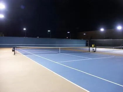 Picture of Under the floodlit sky, Prime Time Athletic Clubâ€™s tennis court offers a serene yet invigorating space for nighttime practice, reflecting its commitment to quality outcomes. Copyright ©2025 Diamond Certified Resource

 - Prime Time Athletic Club