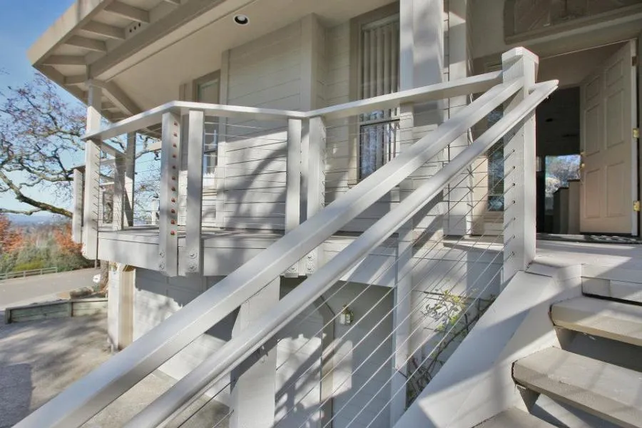 Picture of  The sleek, modern railing design on this outdoor staircase exemplifies Gold Hammer Construction, Inc.'s focus on quality outcomes. This attention to detail is why they have consistently achieved a Highest in Quality rating. Copyright ©2025 Diamond Certified Resource.

 - Gold Hammer Construction, Inc.