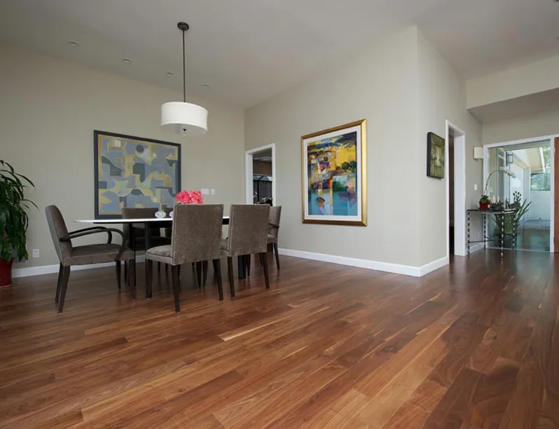 Picture of In a harmonious blend of art and design, a dining area with elegant wooden flooring invites gatherings big and small. Sigura Pro Painting focuses on quality outcomes that enhance such spaces, consistently achieving a Highest in Quality rating. Copyright ©2025 Diamond Certified Resource

 - Sigura Pro Painting