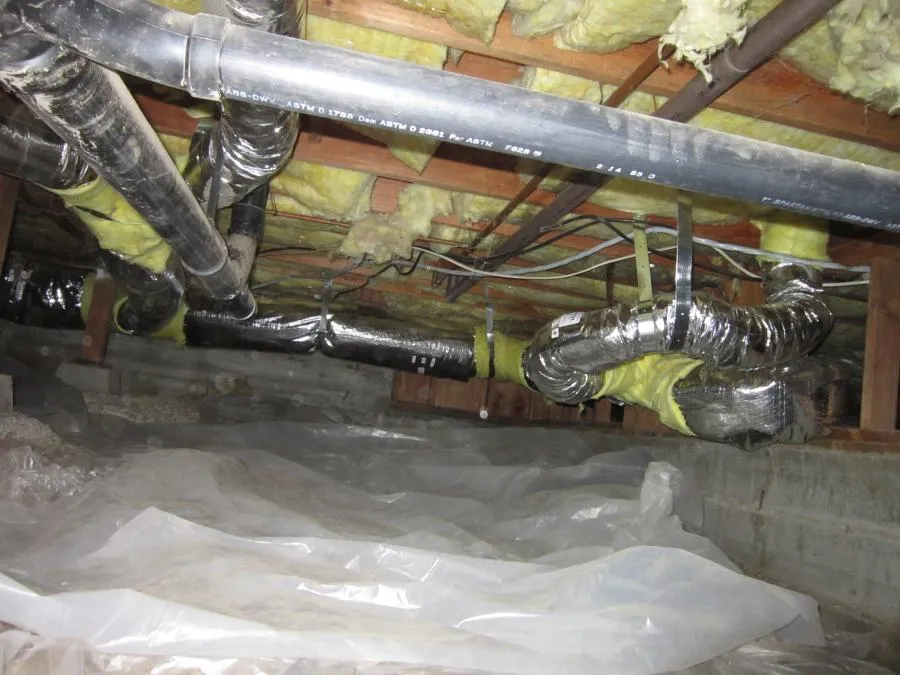 Picture of In the quiet recess of a crawl space, expertly wrapped ductwork reflects Qualtech Heating & Cooling's commitment to quality outcomes. This attention to detail underscores why the company is consistently recognized for expertise and quality. Copyright ©2025 Diamond Certified Resource

 - Qualtech Heating & Cooling