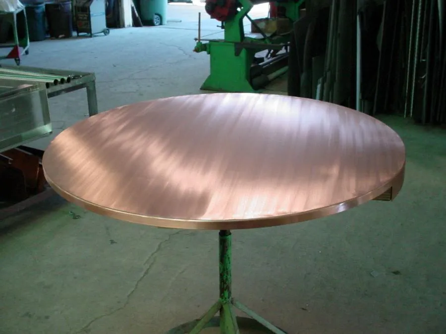Picture of In the heart of Bell Products, Inc., a polished copper table stands as a testament to the company’s dedication to quality outcomes. Such craftsmanship reflects why Bell Products is recognized for expertise and quality. Copyright ©2025 Diamond Certified Resource. - Bell Products, Inc.