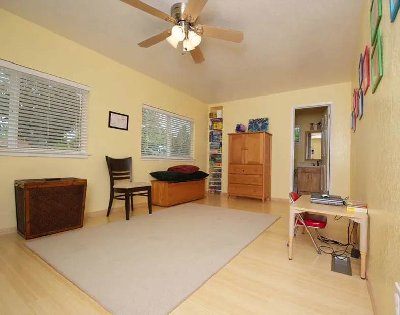 Picture of A tastefully arranged room showcases Sigura Pro Painting's dedication to quality outcomes. The subtle play of yellow walls against natural light highlights their expertise, creating a serene space perfect for relaxation and creativity. Copyright ©2025 Diamond Certified Resource - Sigura Pro Painting