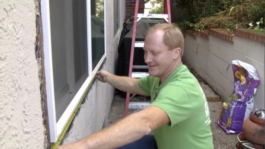 Picture of A craftsman from Alexander Company carefully measures a window frame, exemplifying their focus on quality outcomes. This meticulous approach highlights why they consistently achieve a Highest in Quality rating. Copyright ©2025 Diamond Certified Resource

 - Alexander Company