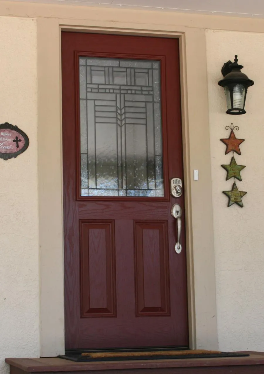 Picture of  A finely crafted wooden door with intricate glasswork hints at the meticulous attention to detail that Quality First Home Improvement, Inc. brings to every project. Their dedication to quality outcomes has earned them a Diamond Certified status. Copyright ©2025 Diamond Certified Resource.

 - Quality First Home Improvement, Inc.